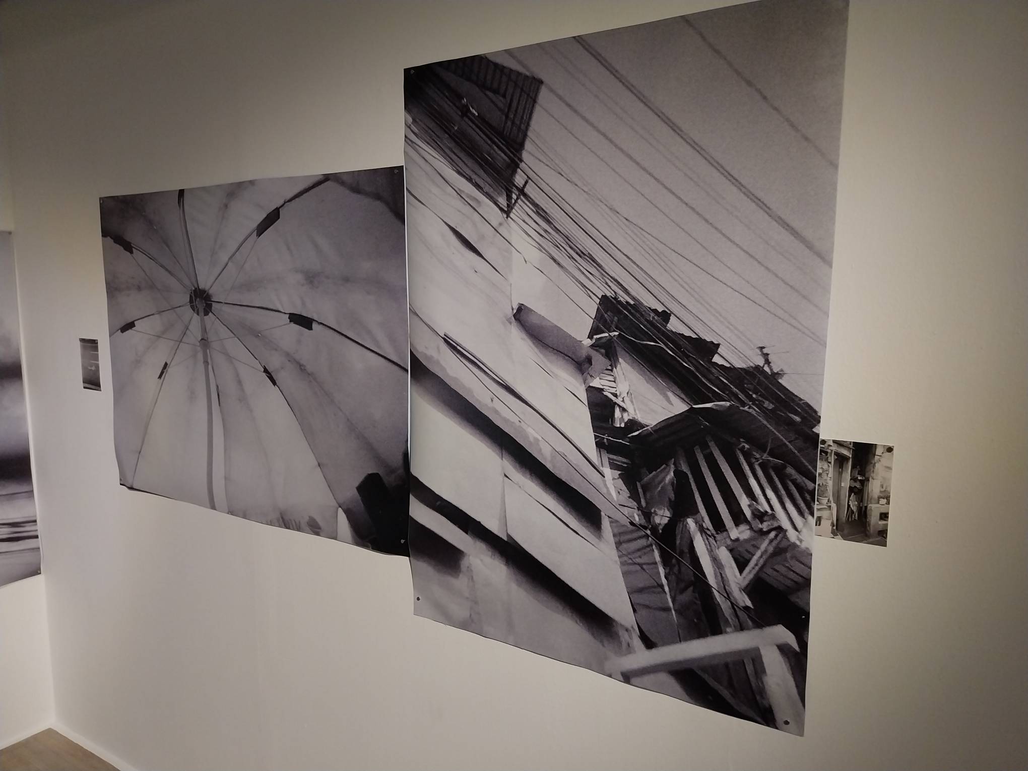 Photos of an umbrella and buildings in the city. Photo by Elle Yap.