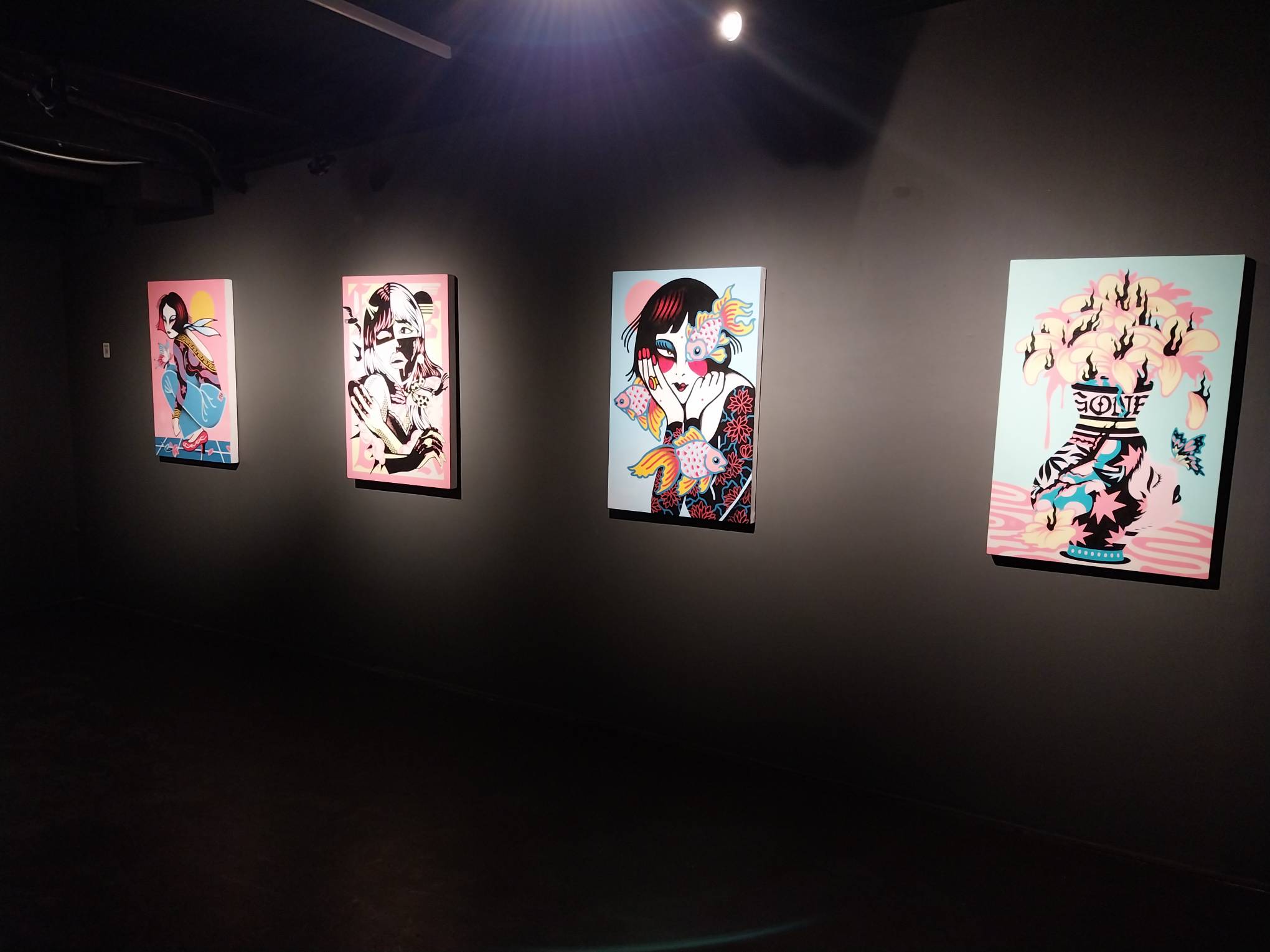 20240516_182524 - BluPrint Some of the paintings featured for"Misery Loves Company." Photo by Elle Yap.