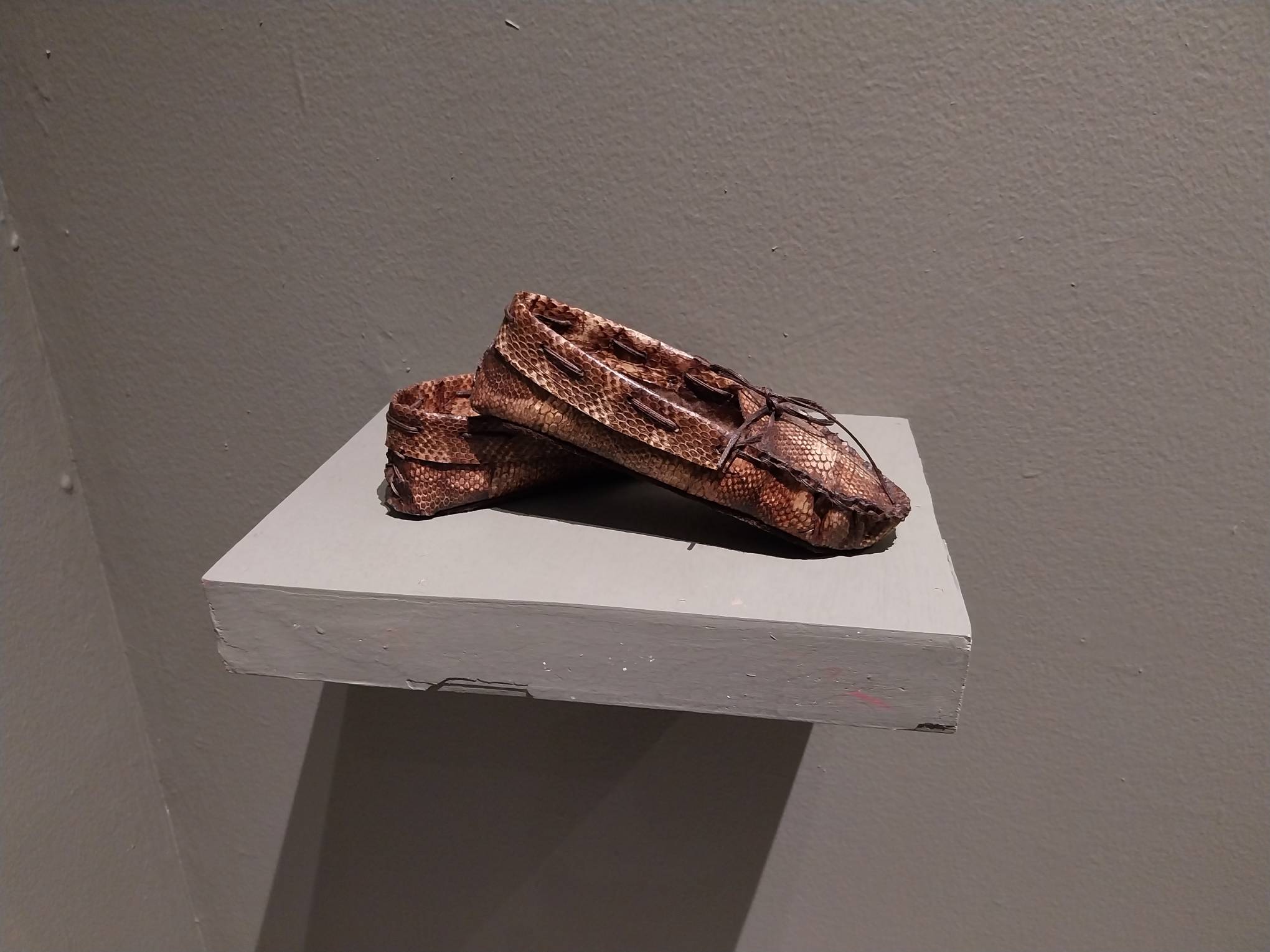 Snake moccasins for "The Dream" painting. Photo by Elle Yap.