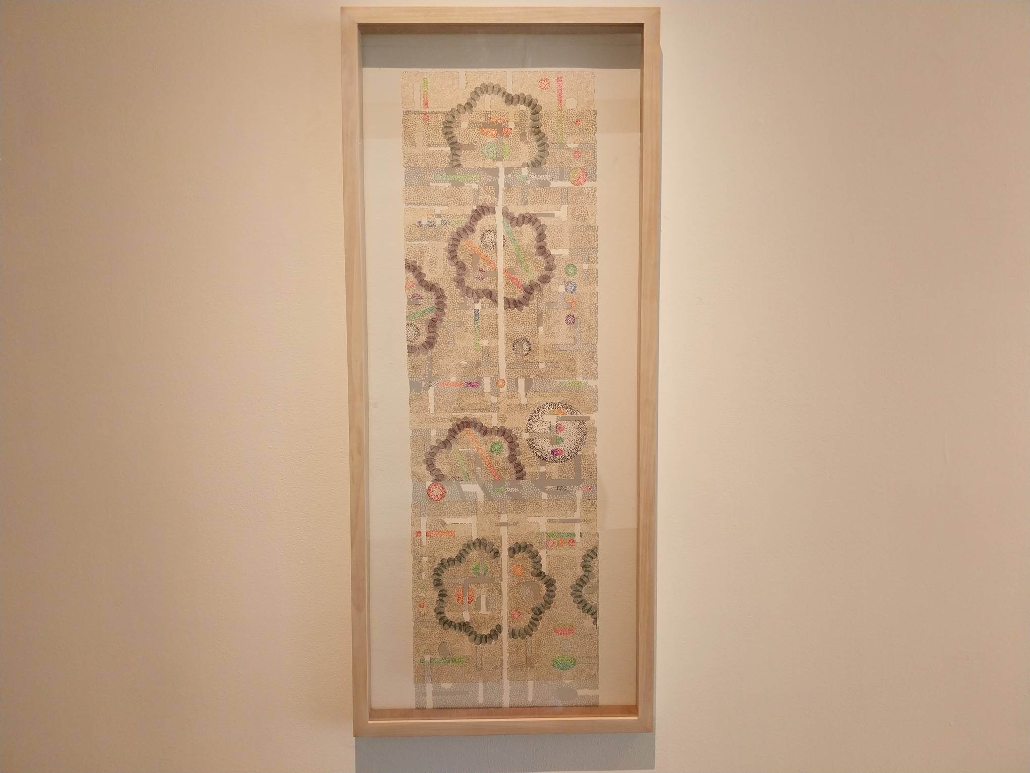 A long-form giant work from the exhibit. Photo by Elle Yap.