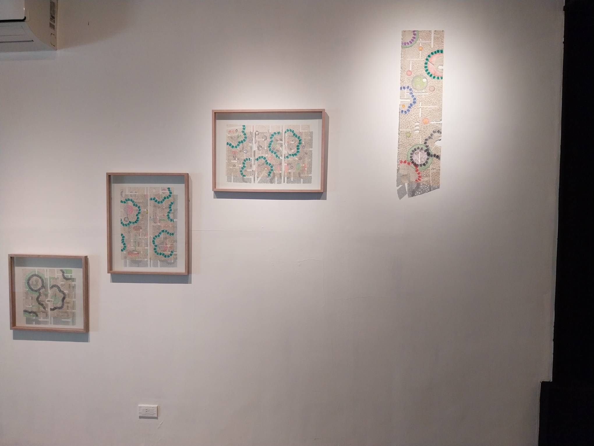 Four works shown in "From Ash We Came" at Art Cube Gallery. Photo by Elle Yap.