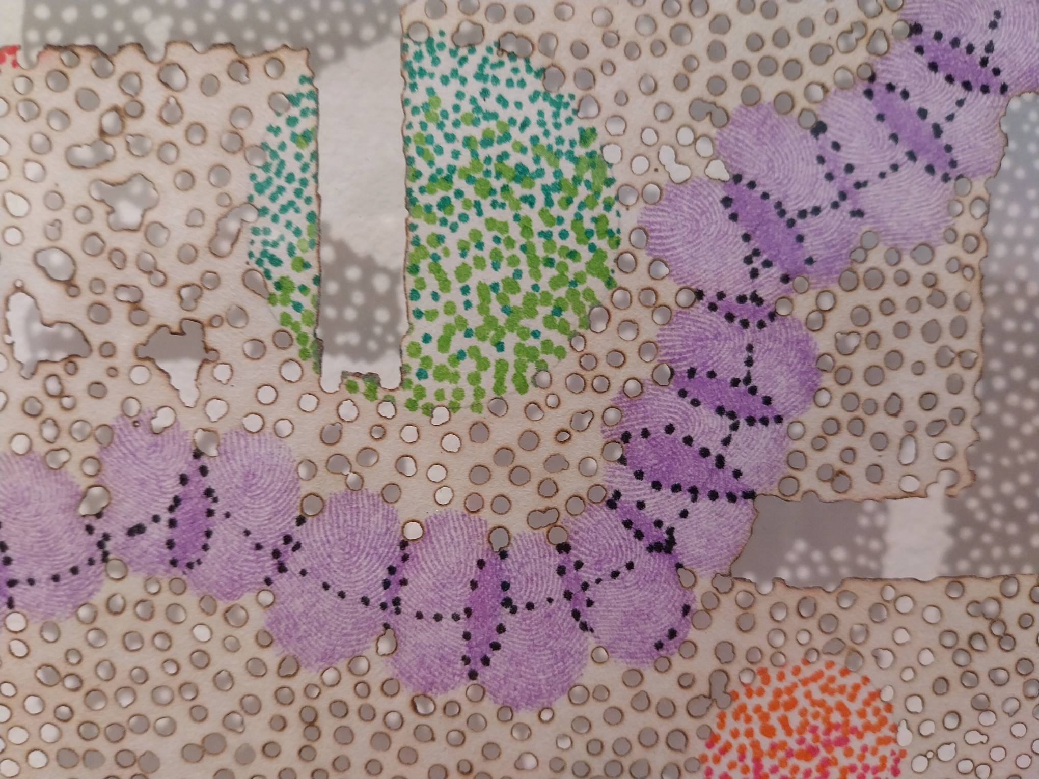 Purple fingerprints in one of the works. Photo by Elle Yap.