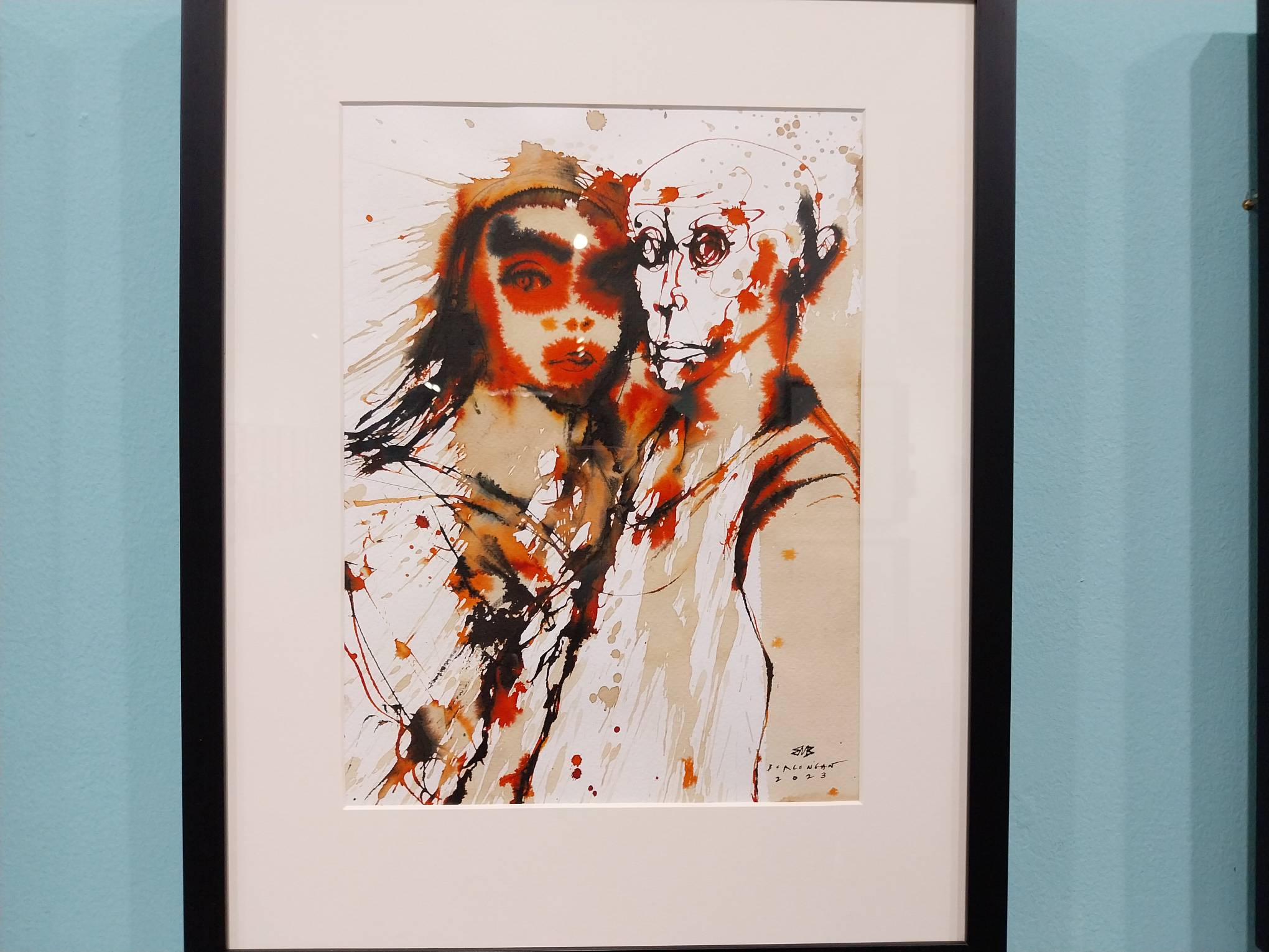 Two figures looking at the audience. Photo by Elle Yap.