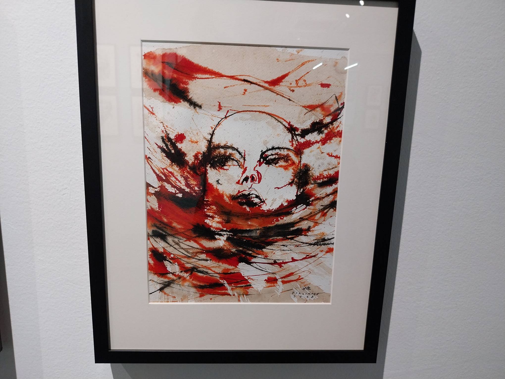 The head of a figure under liquids. Photo by Elle Yap.