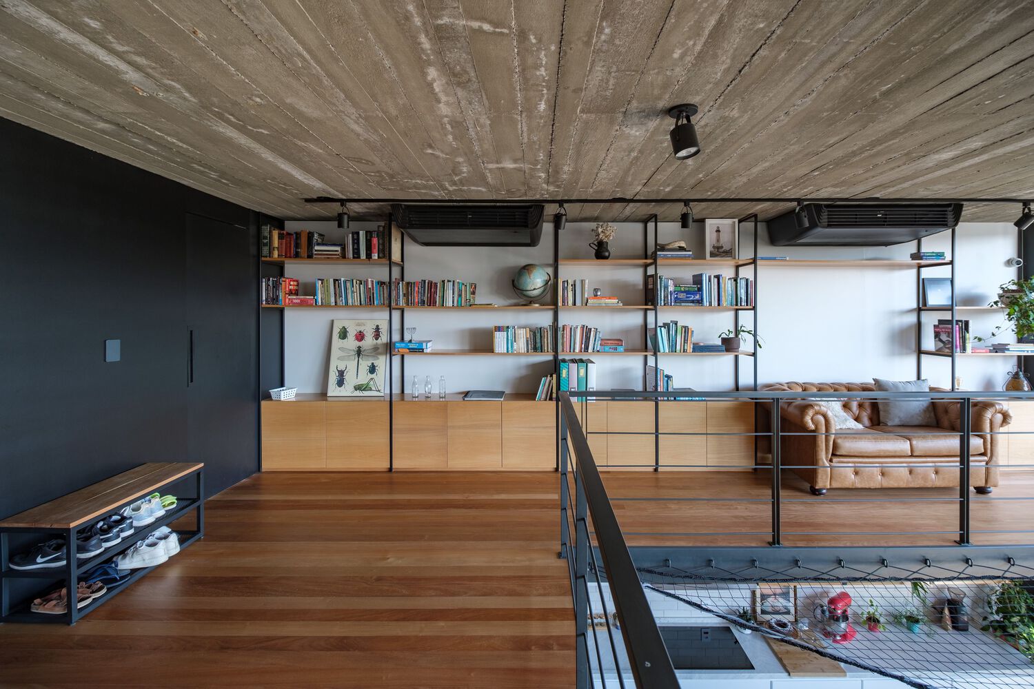 Bookshelves in the second floor. Photo by Gabriel Konrath.
