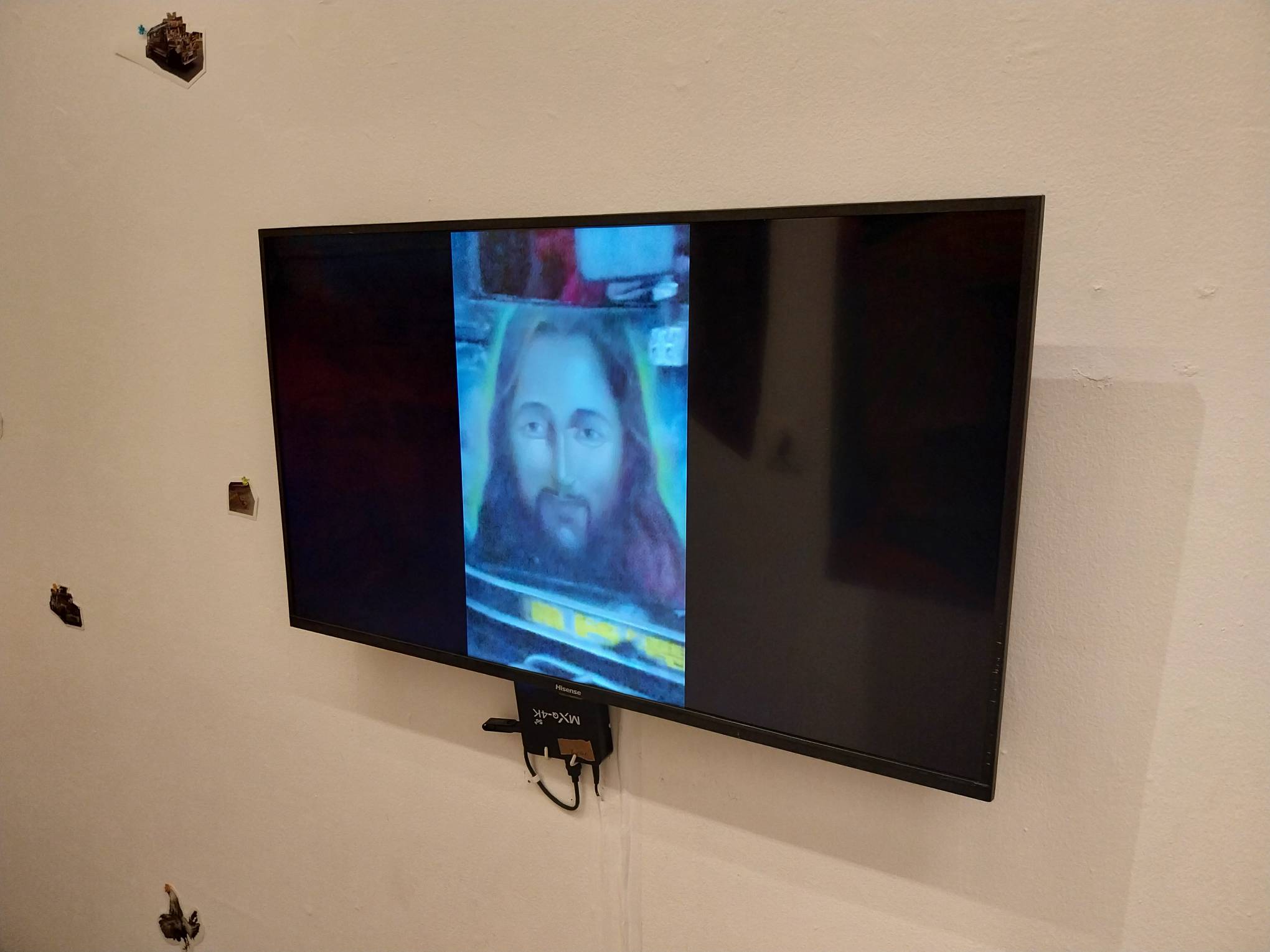 TV screen with changing images. Photo by Elle Yap.