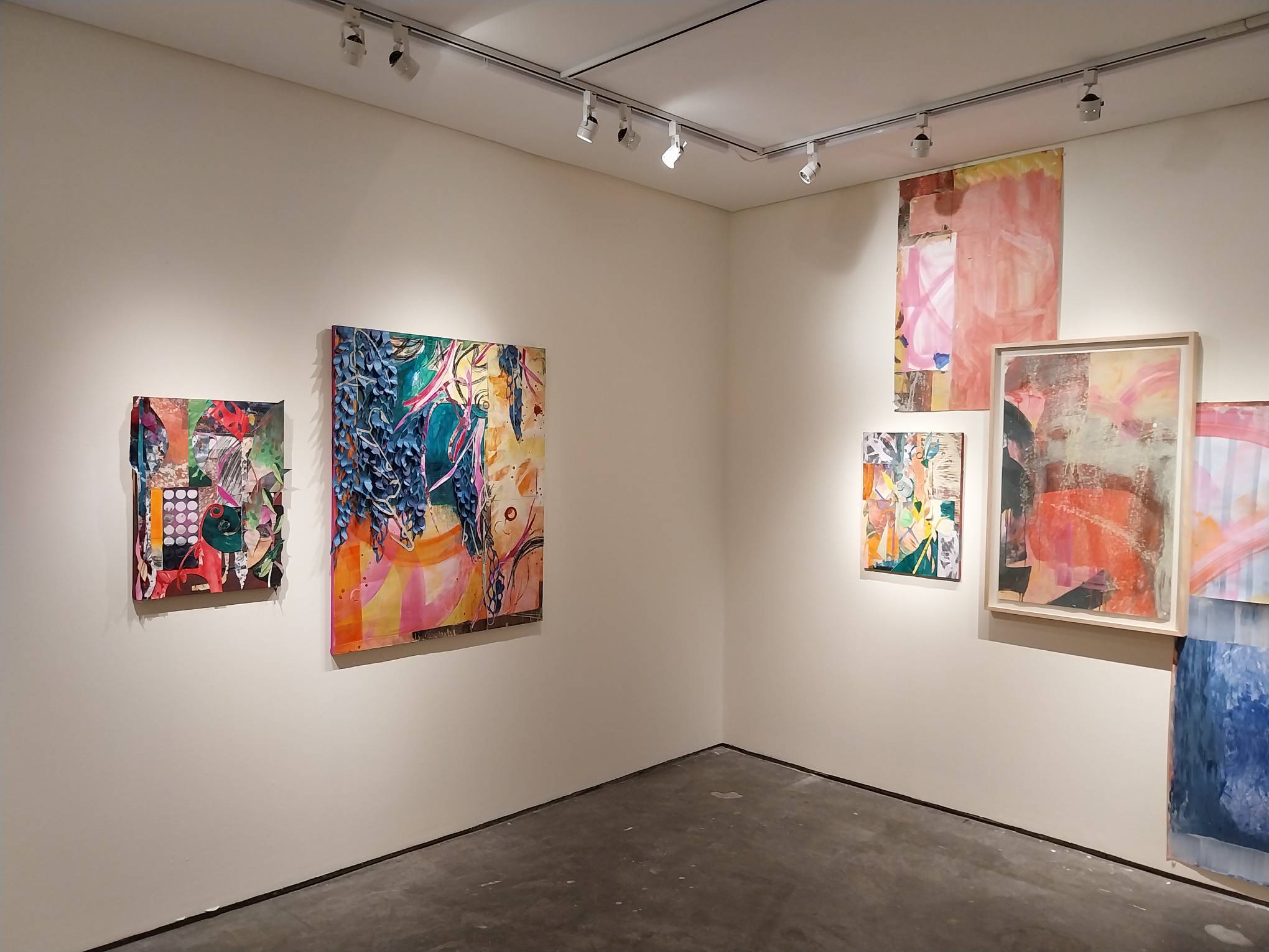 Some of the paintings in the exhibit. Photo by Elle Yap.