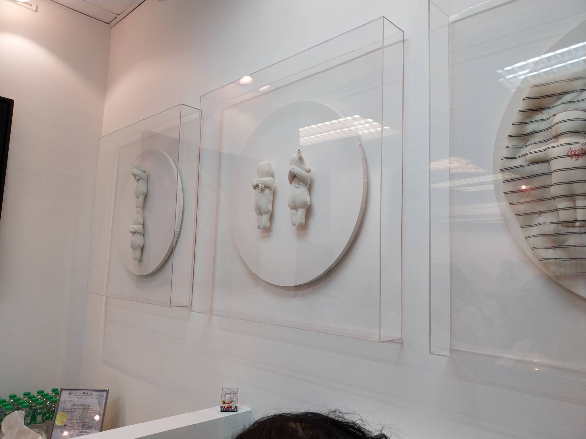 Framed figurines. Photo by Elle Yap.