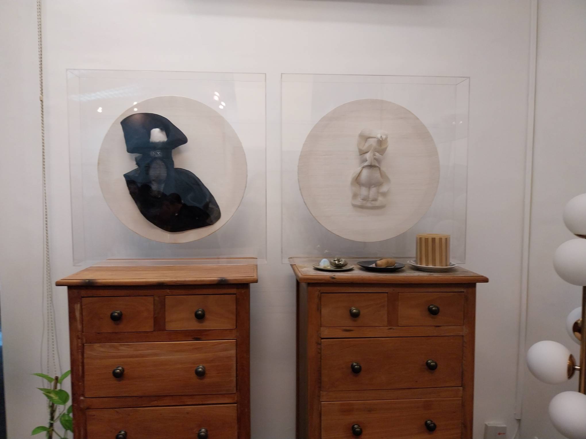 Framed figurines. Photo by Elle Yap.