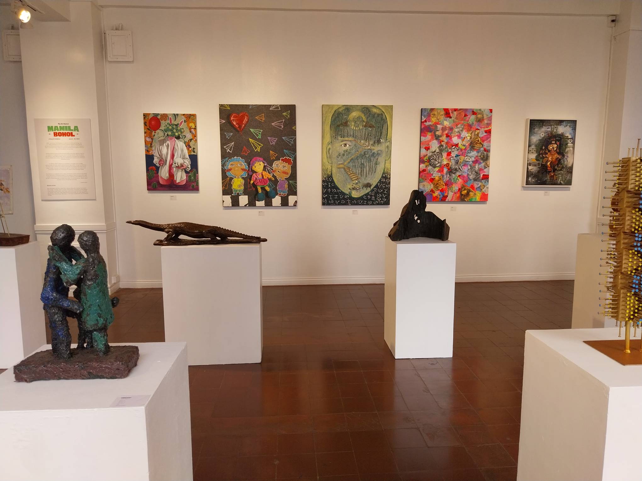 Side view of the sculptures and paintings for the exhibit. Photo by Elle Yap.