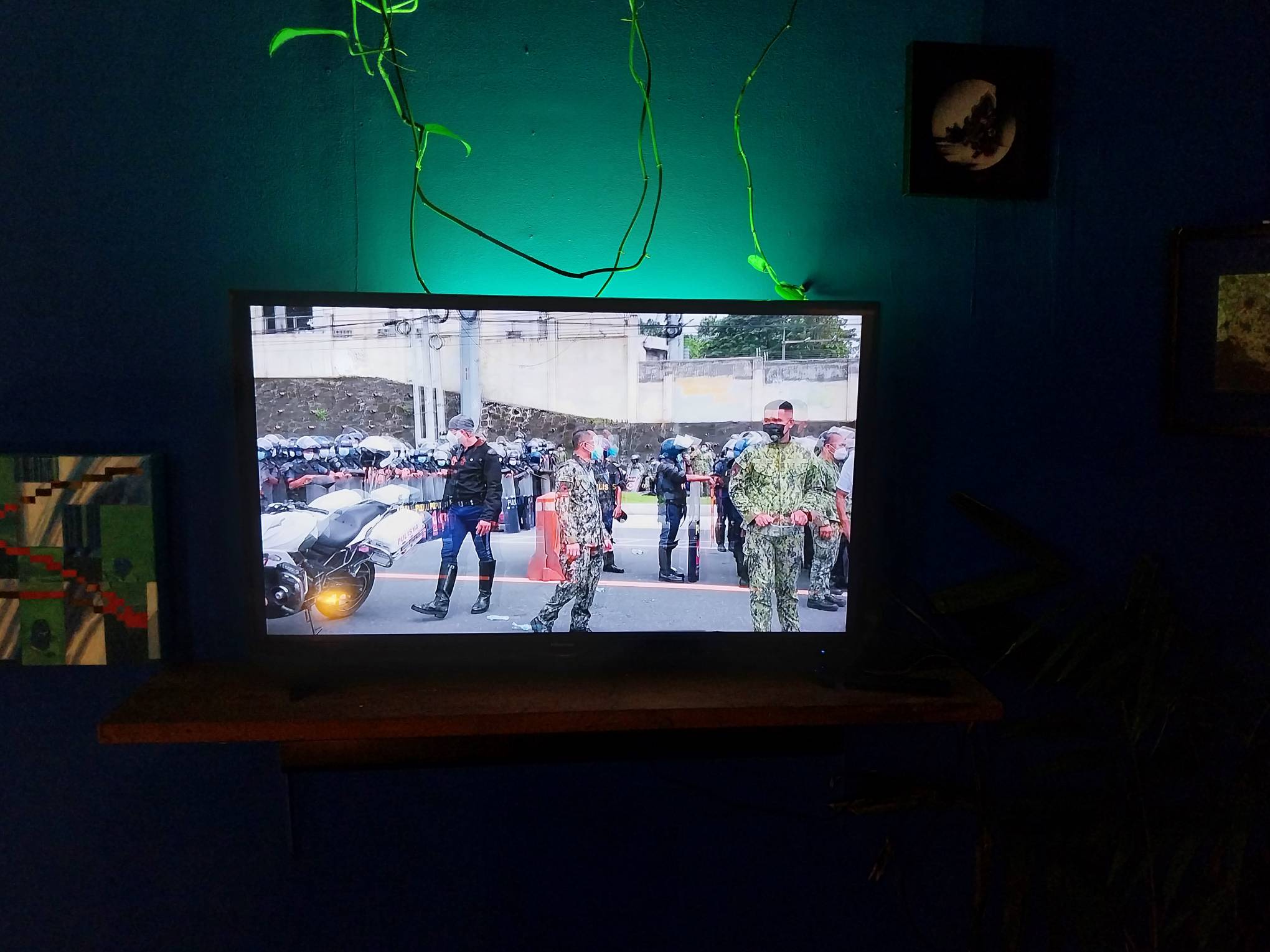 A video containing police officers in riot gear. Photo by Elle Yap.