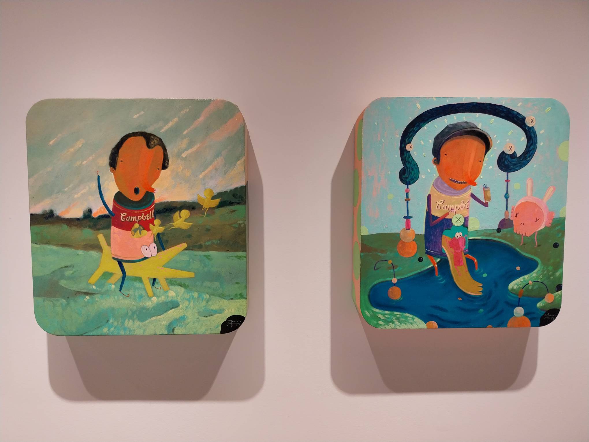 Two pop culture parodies by Farley del Rosario for "The Soup Can Factory." Photo by Elle Yap.