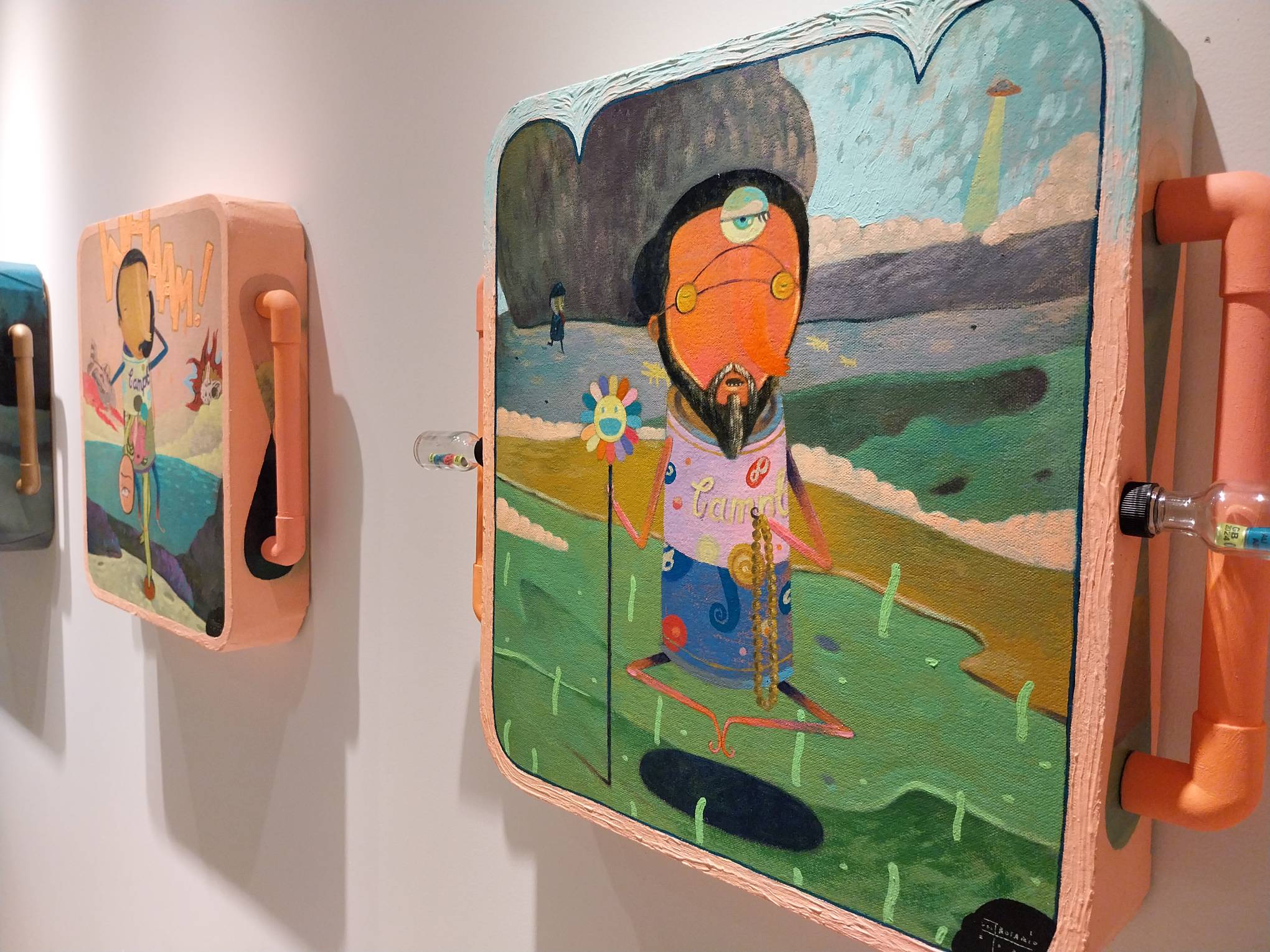 Side view of two paintings. Photo by Elle Yap.