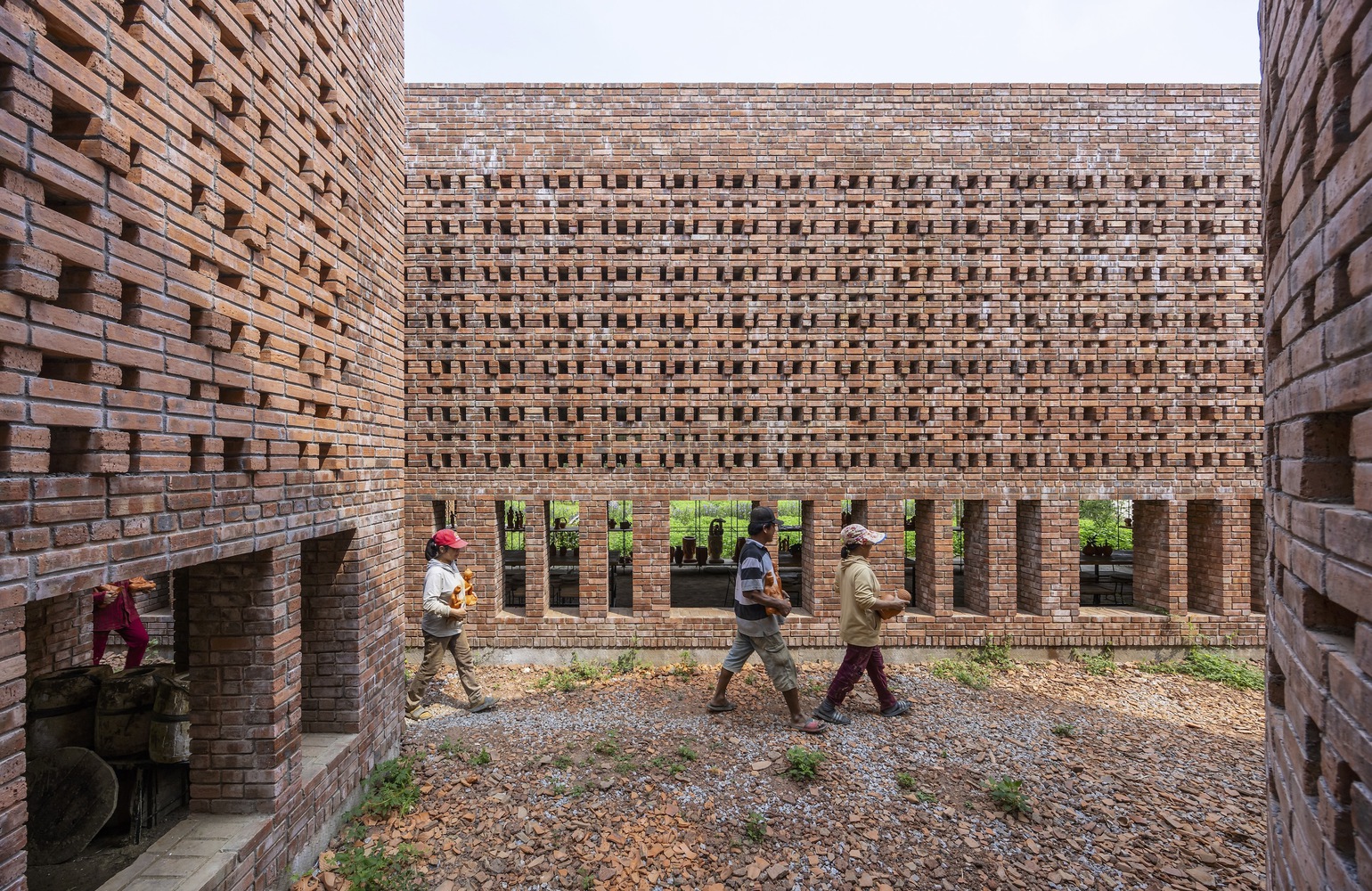 A view of the brick walls with the low windows and ventilation holes. Photo by Trieu Chien.