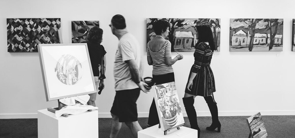 People attending a museum in New Zealand. Photo by Flagstaff Gallery. Source: Wikimedia Commons.