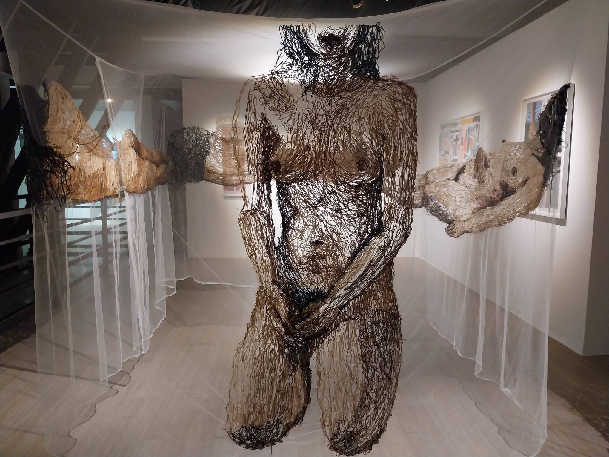 Perspective of "Kulambo" with a nude woman kneeling to the audience. Photo by Elle Yap.