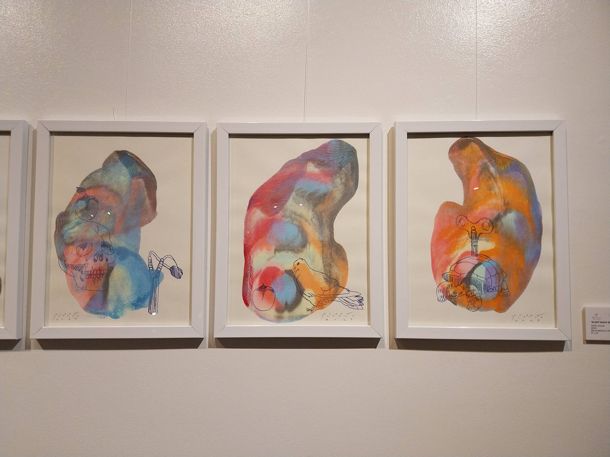 Three paintings shown in "Resurrect." Photo by Elle Yap.