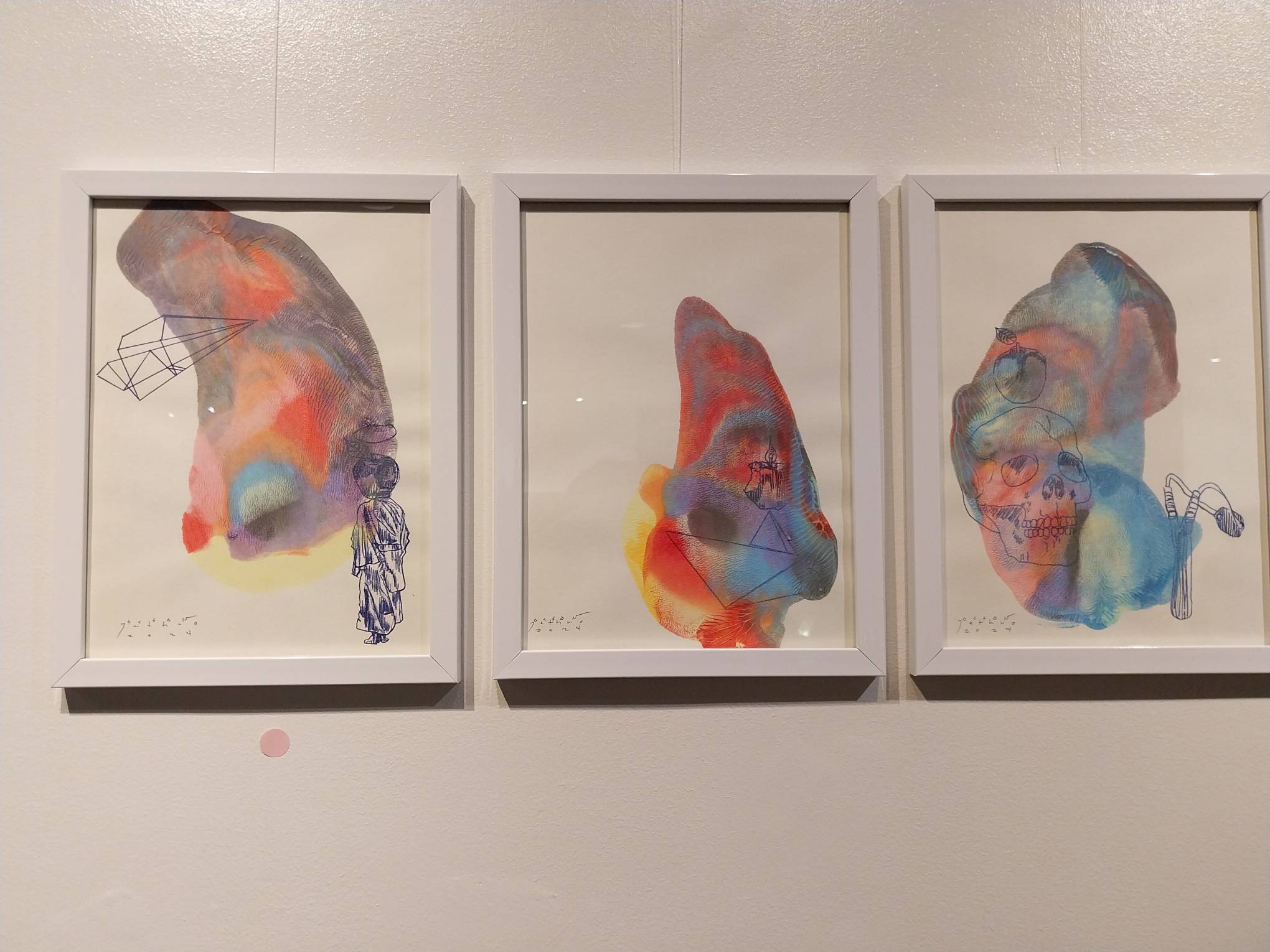 Three paintings shown in "Resurrect." Photo by Elle Yap.