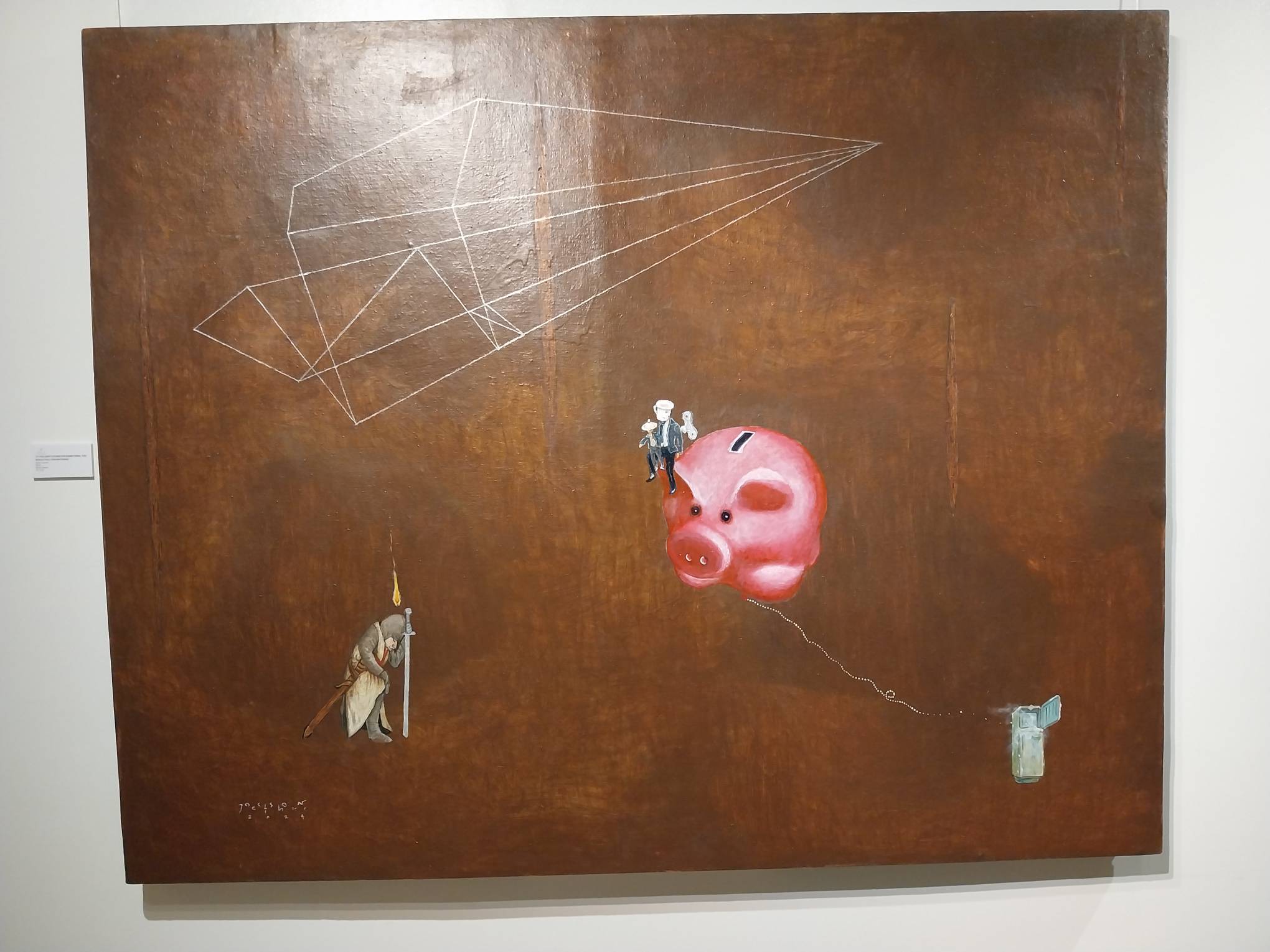 A painting with a knight and a piggy bank by Jethro Jocson. Photo by Elle Yap. 
