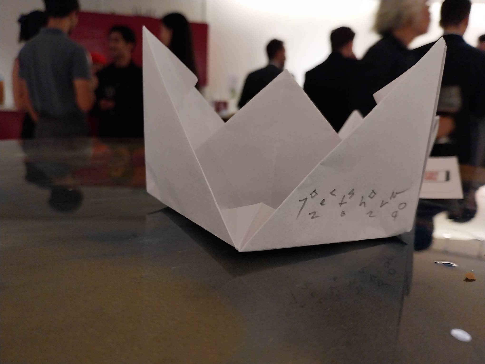 A paper boat made by the artist. Photo by Elle Yap.