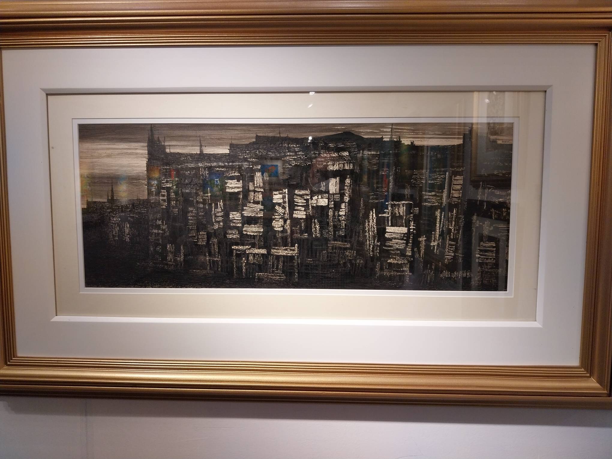 Painting of a dark city landscape. Photo by Elle Yap.