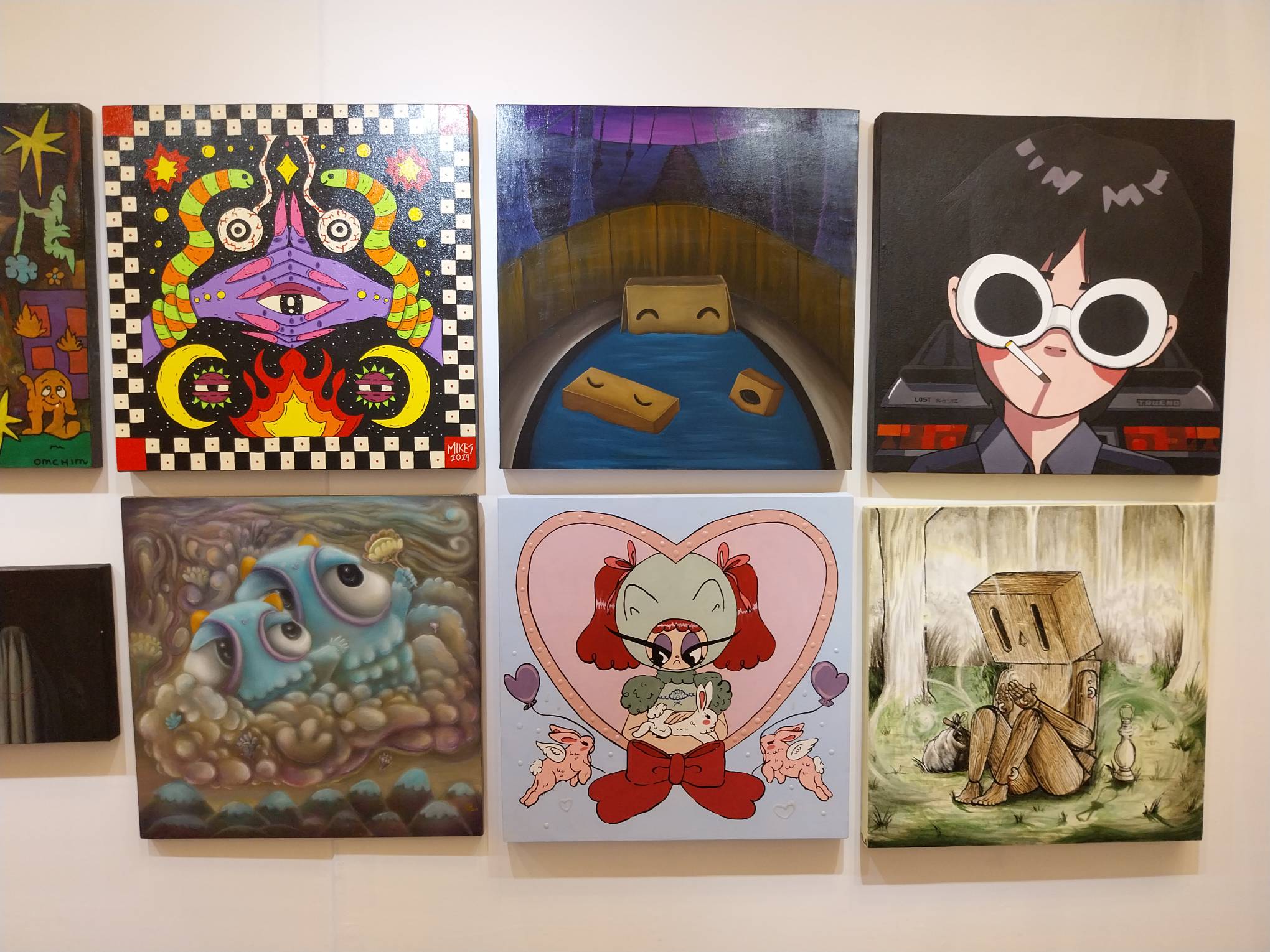Paintings presented for MoCAF Discoveries. Photo by Elle Yap.