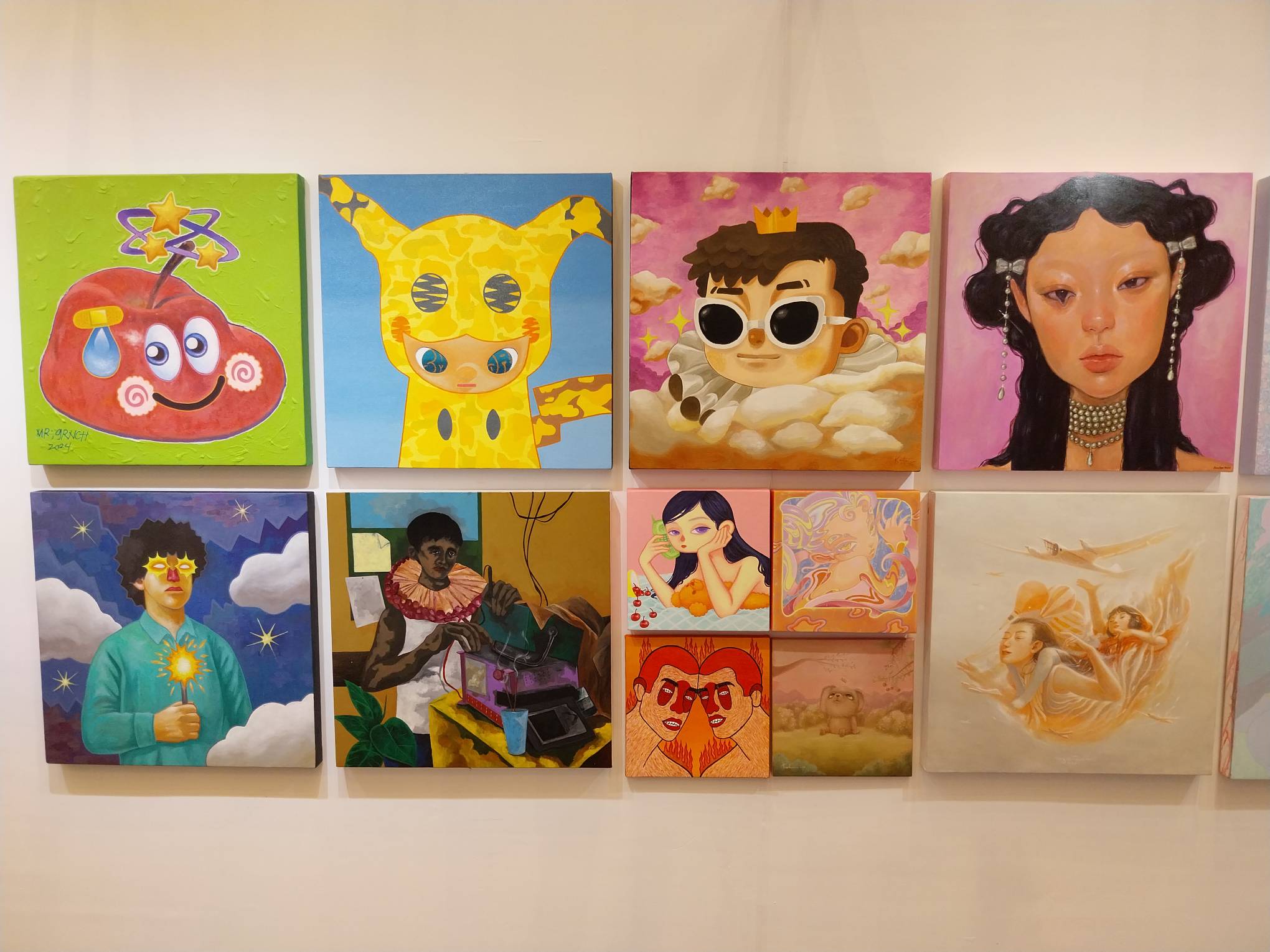 Paintings presented for MoCAF Discoveries. Photo by Elle Yap.