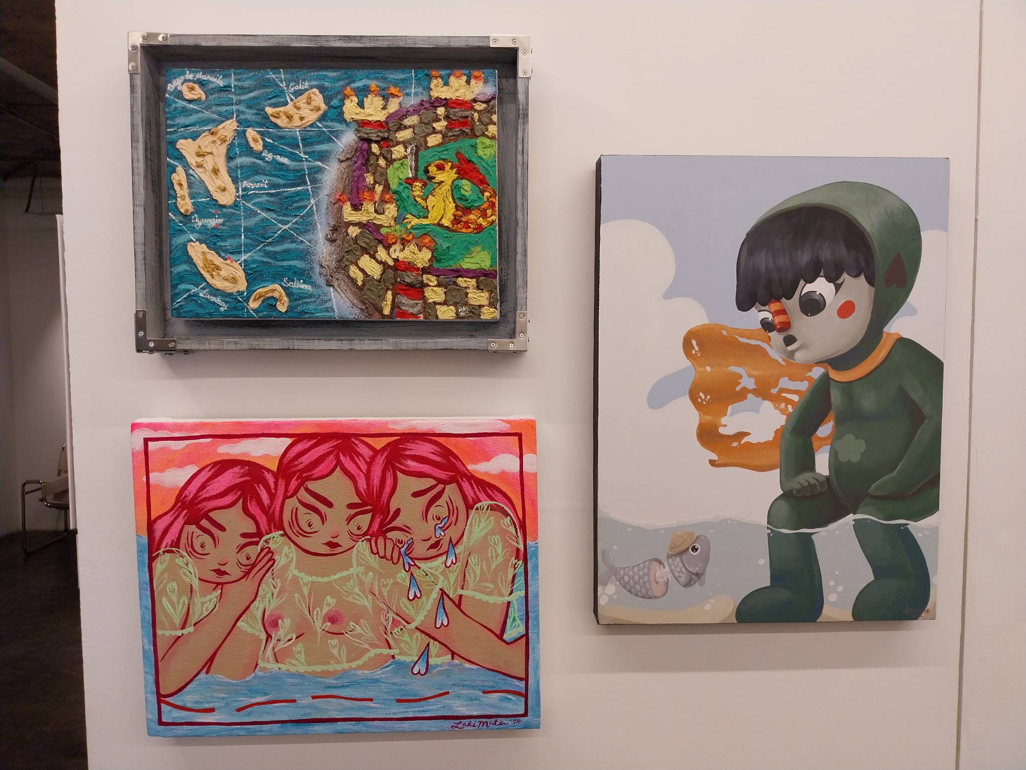 Three works for the "Territorial" exhibit, including "Even the Fishes are Filipino" by Jesse Camacho. Photo by Elle Yap.