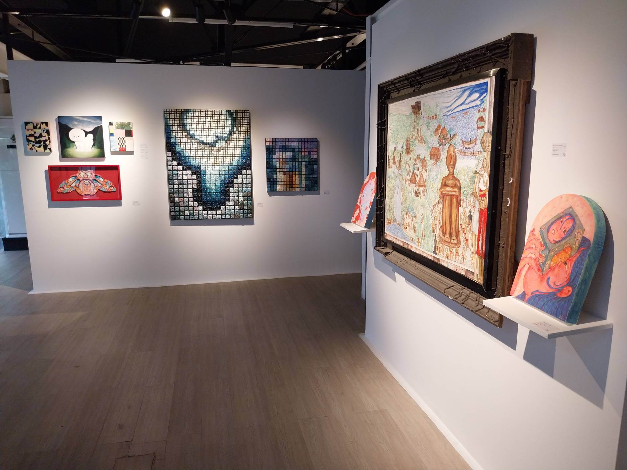 Works in view at Gravity Art Space's "Visual Odyssey" exhibit. Photo by Elle Yap.