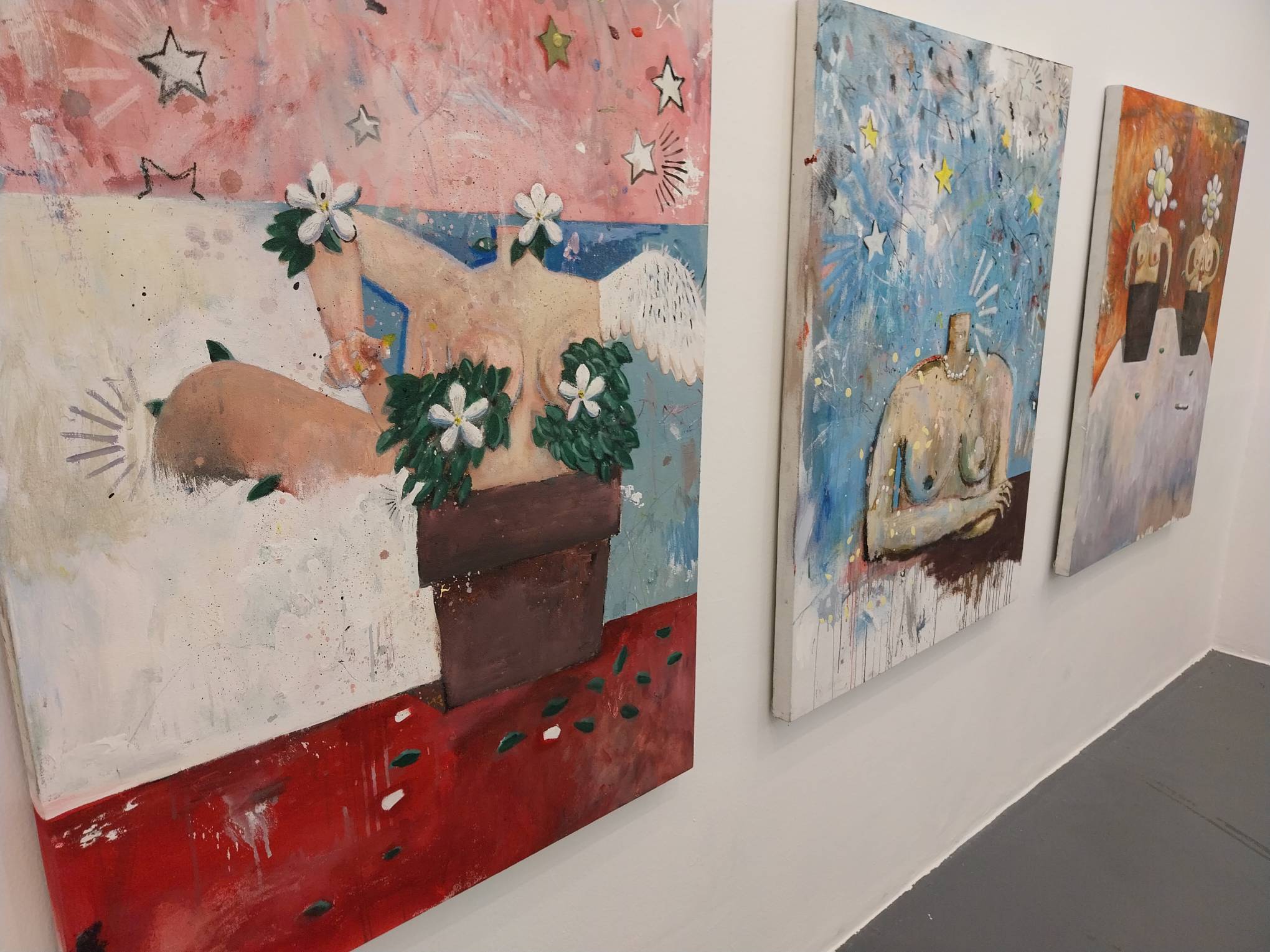 Three of the torso paintings shown at "Horror Vacui" at Vinyl on Vinyl. Photo by Elle Yap.