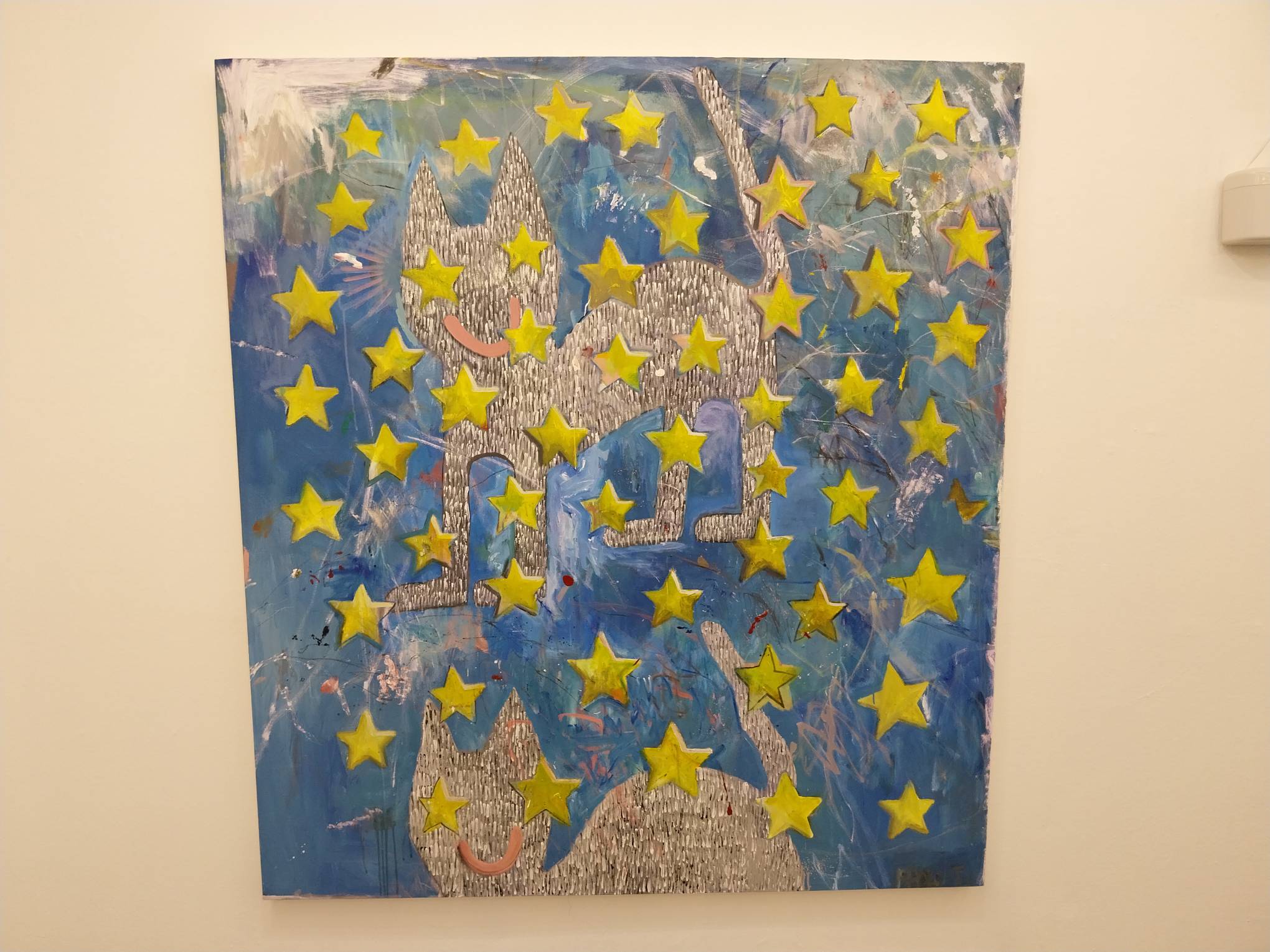 Paolo Torres painting of two cats surrounded by stars. Photo by Elle Yap.