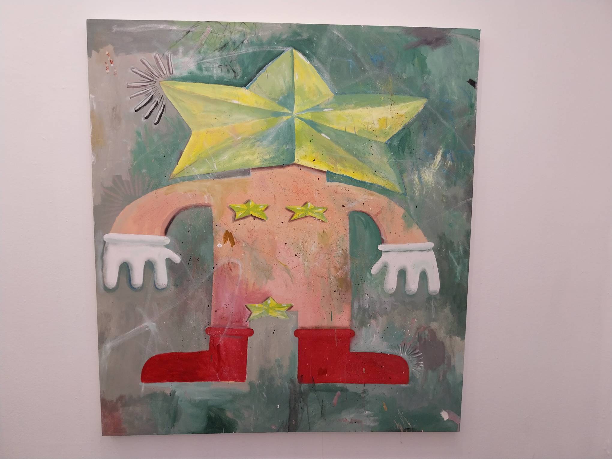 A painting of a nude man with gloves, boots, and a star for a head. Photo by Elle Yap.