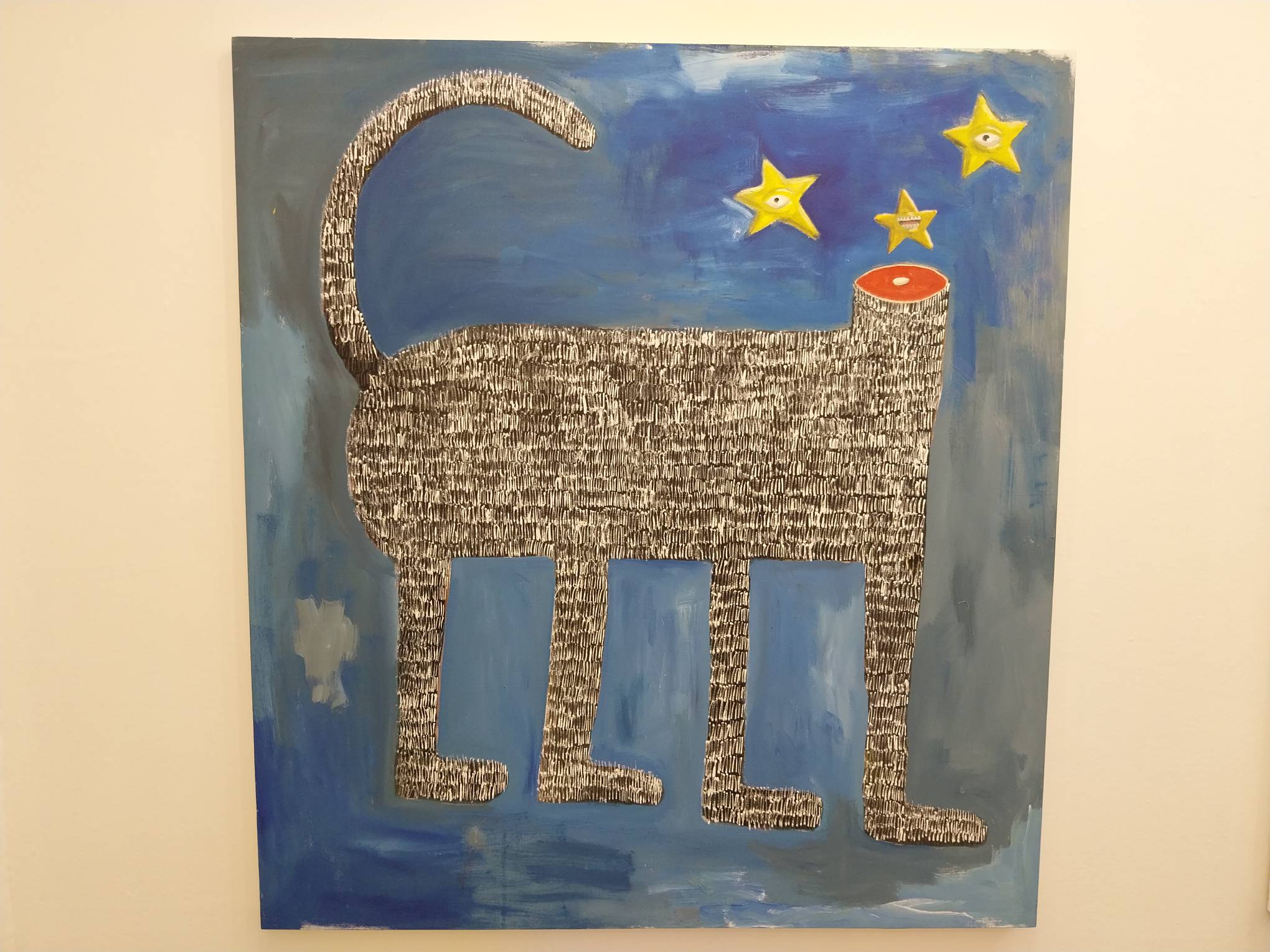 A painting of a headless cat. Photo by Elle Yap.