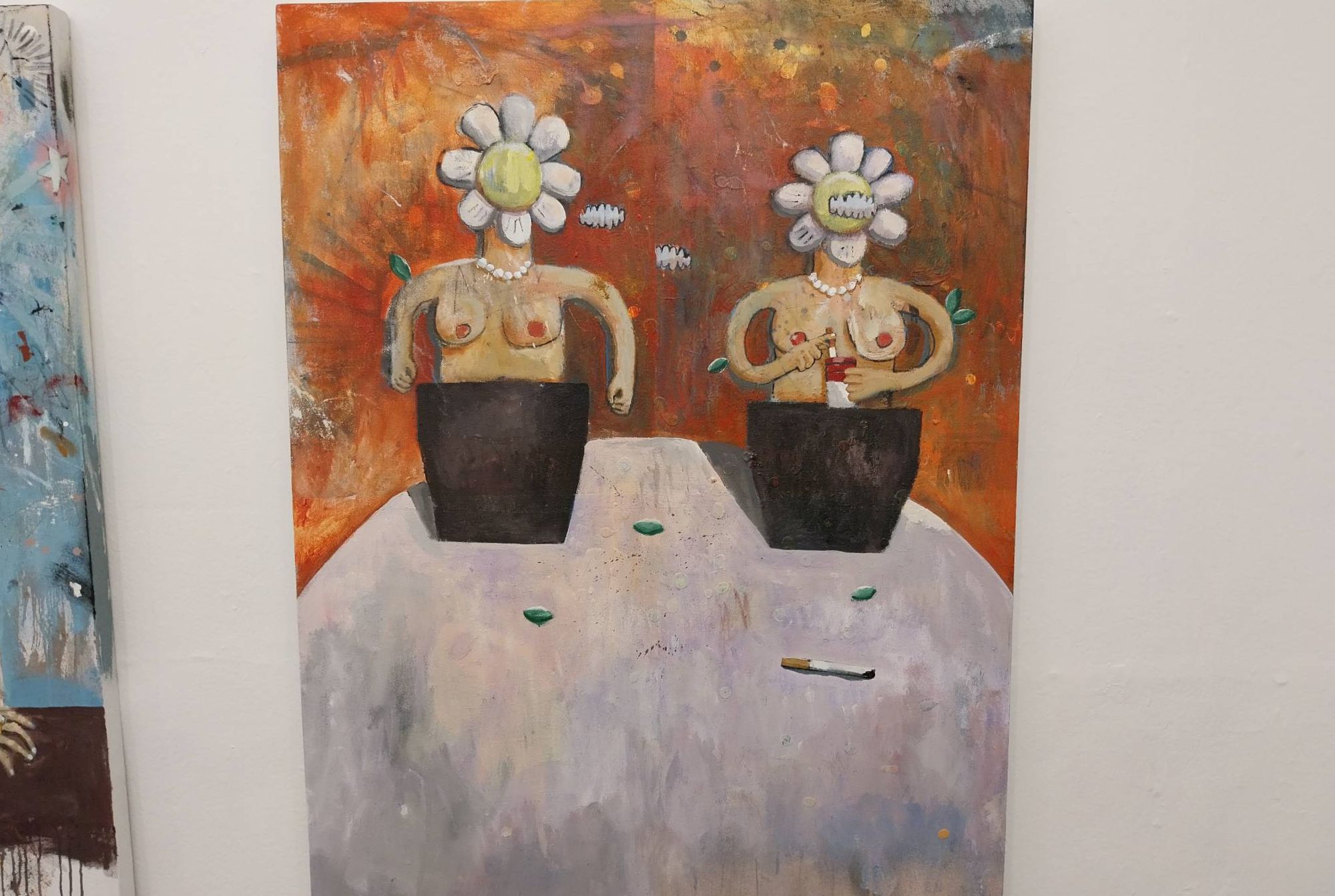 Two torso with flowers for heads. Photo by Elle Yap.