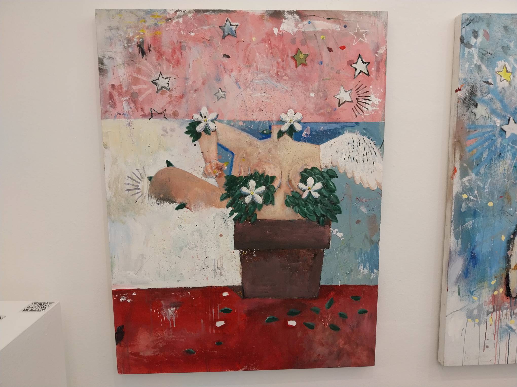 A painting by Paolo Torres of a woman in a vase. Photo by Elle Yap.