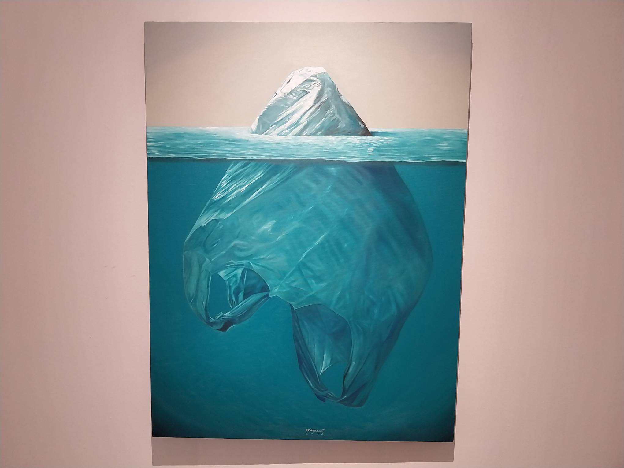 A painting by Kiko Marquez depicting a plastic bag as an iceberg. Photo by Elle Yap.
