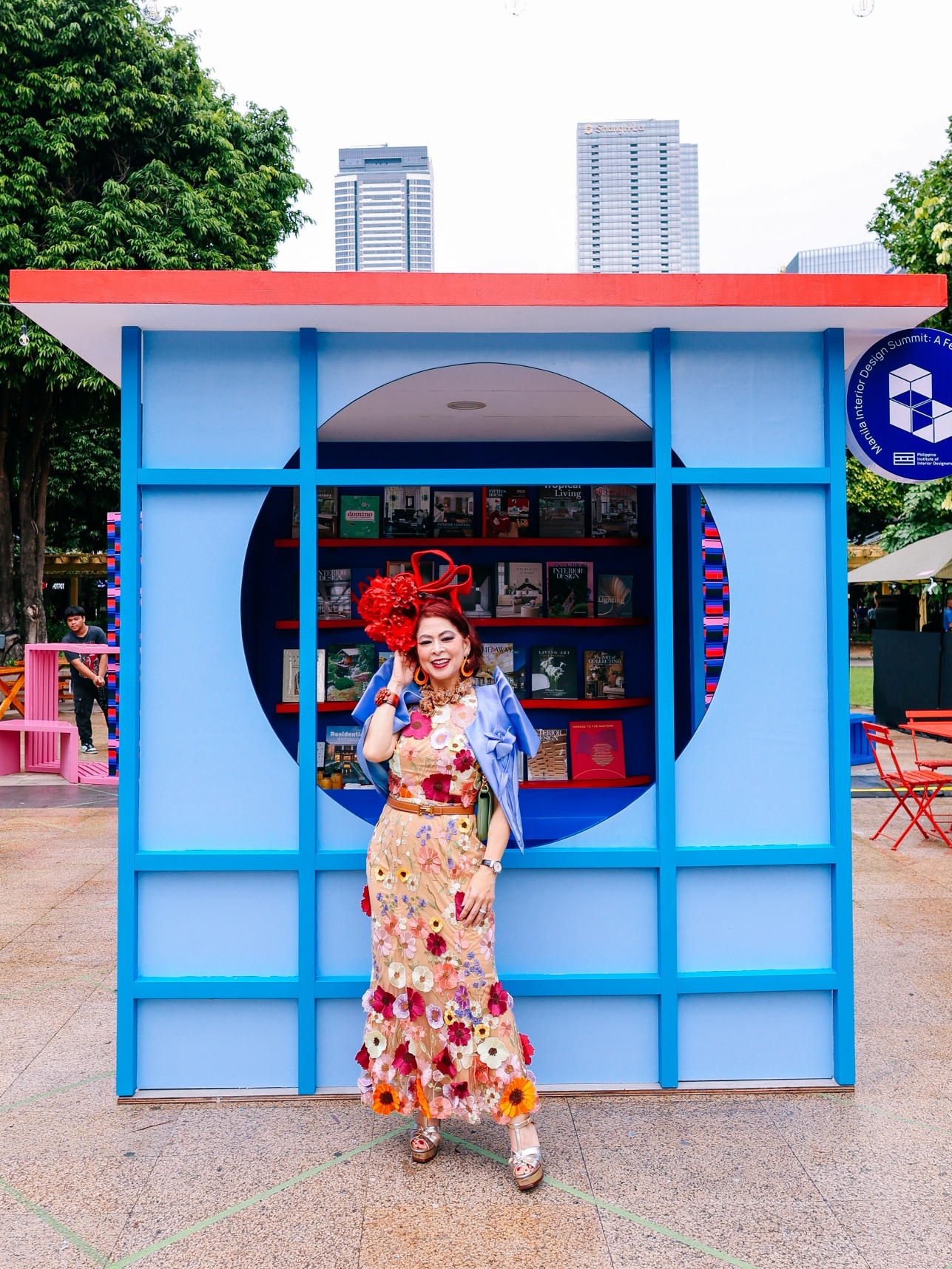 IDr. Tessa Prieto-Valdes standing in front of the MIDS 2024 booth.