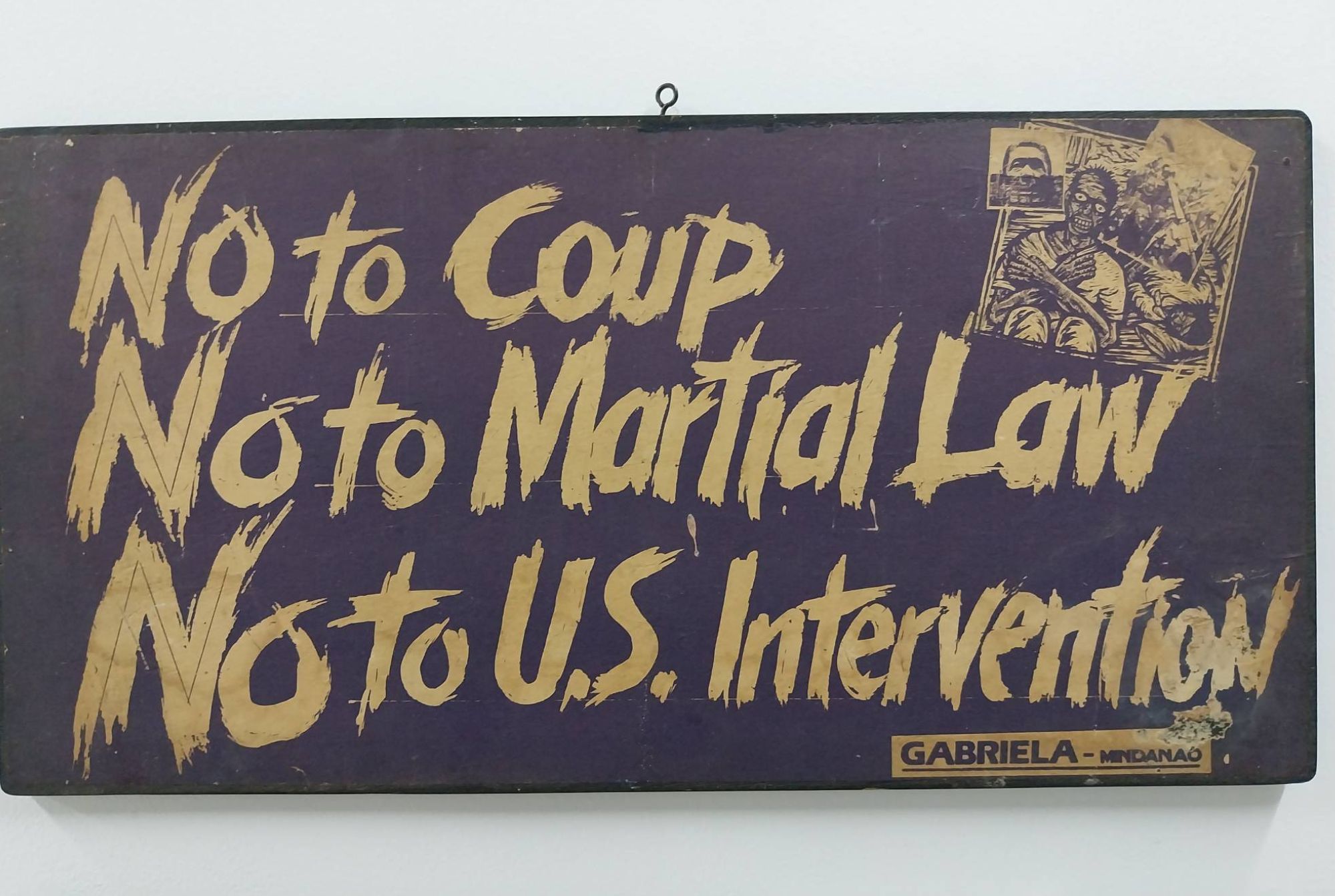 A placard by GABRIELA Women's Party as featured in the exhibit. Photo by Elle Yap.