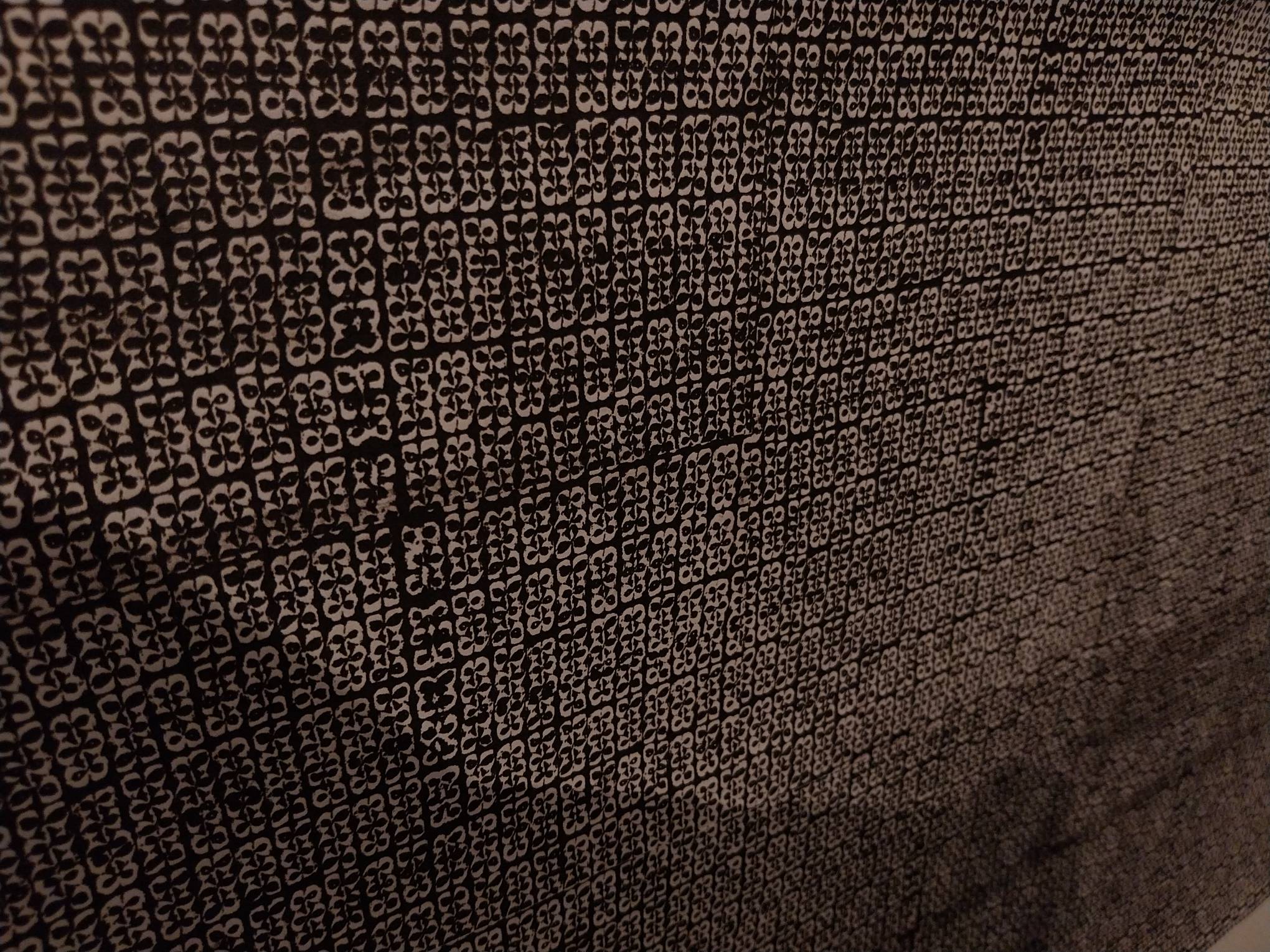 Painting of really small owl faces. Photo by Patricia Yap.