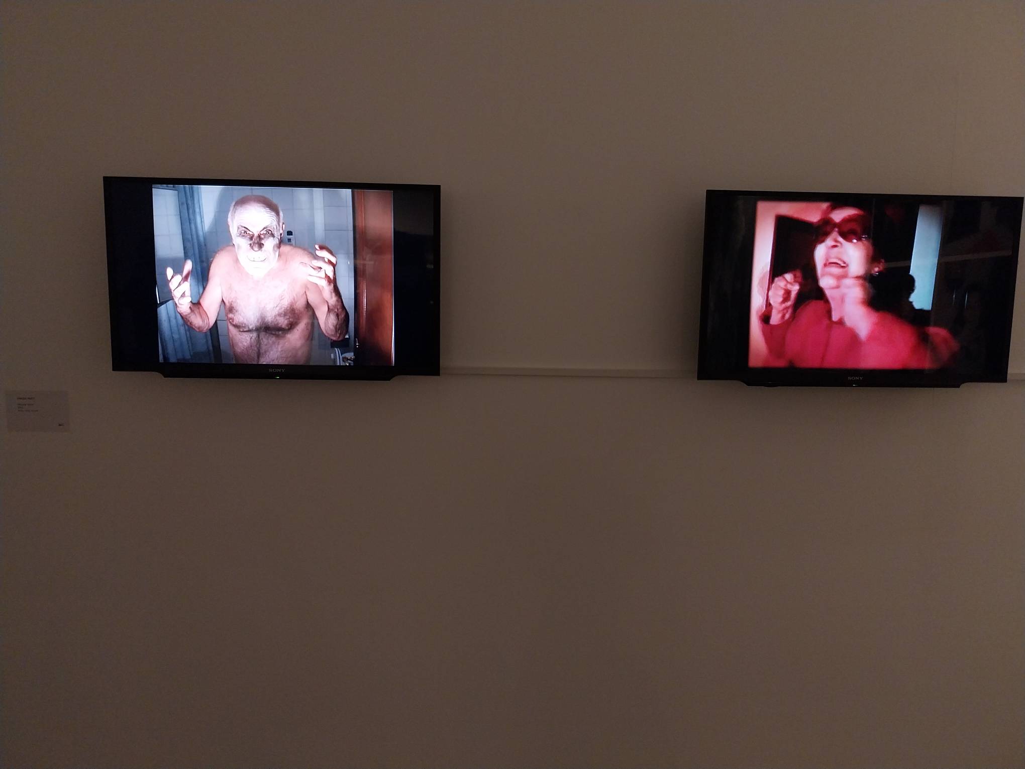 Videos by Enrique Marty shown on two televisions. Photo by Patricia Yap.