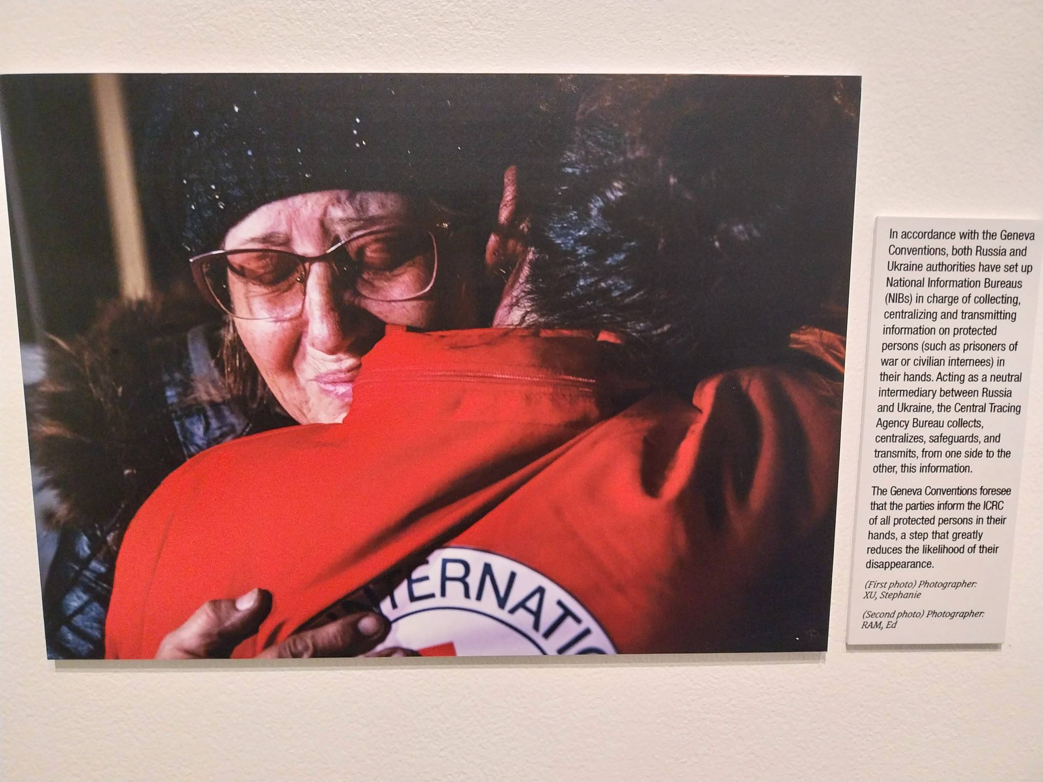 Photograph someone hugging a Red Cross worker. Picture by Elle Yap.