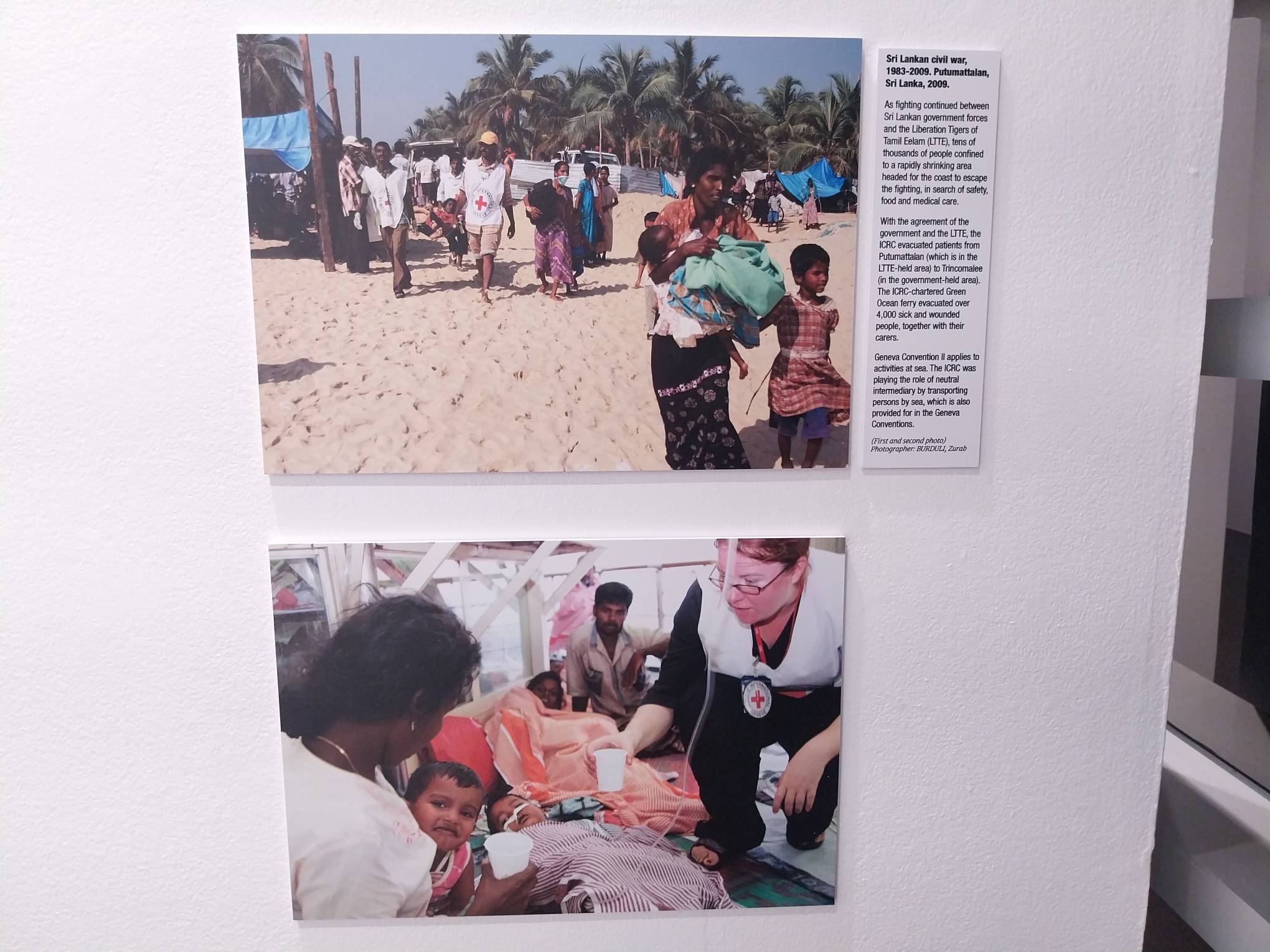 Two images shown in “75 Years of the Geneva Conventions." Photo by Elle Yap.