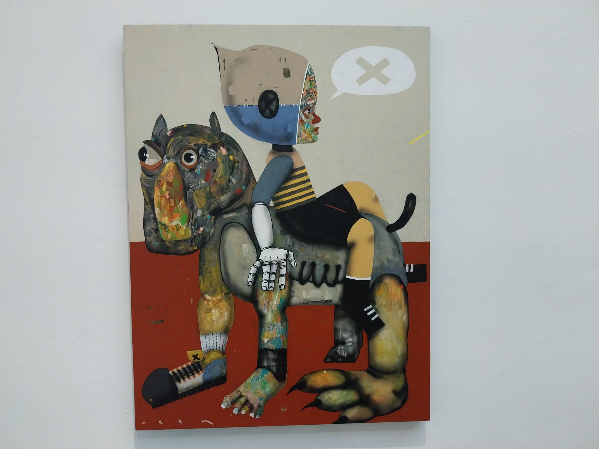 Painting of a child sitting on a dog by Reen Barrera. Photo by Elle Yap.