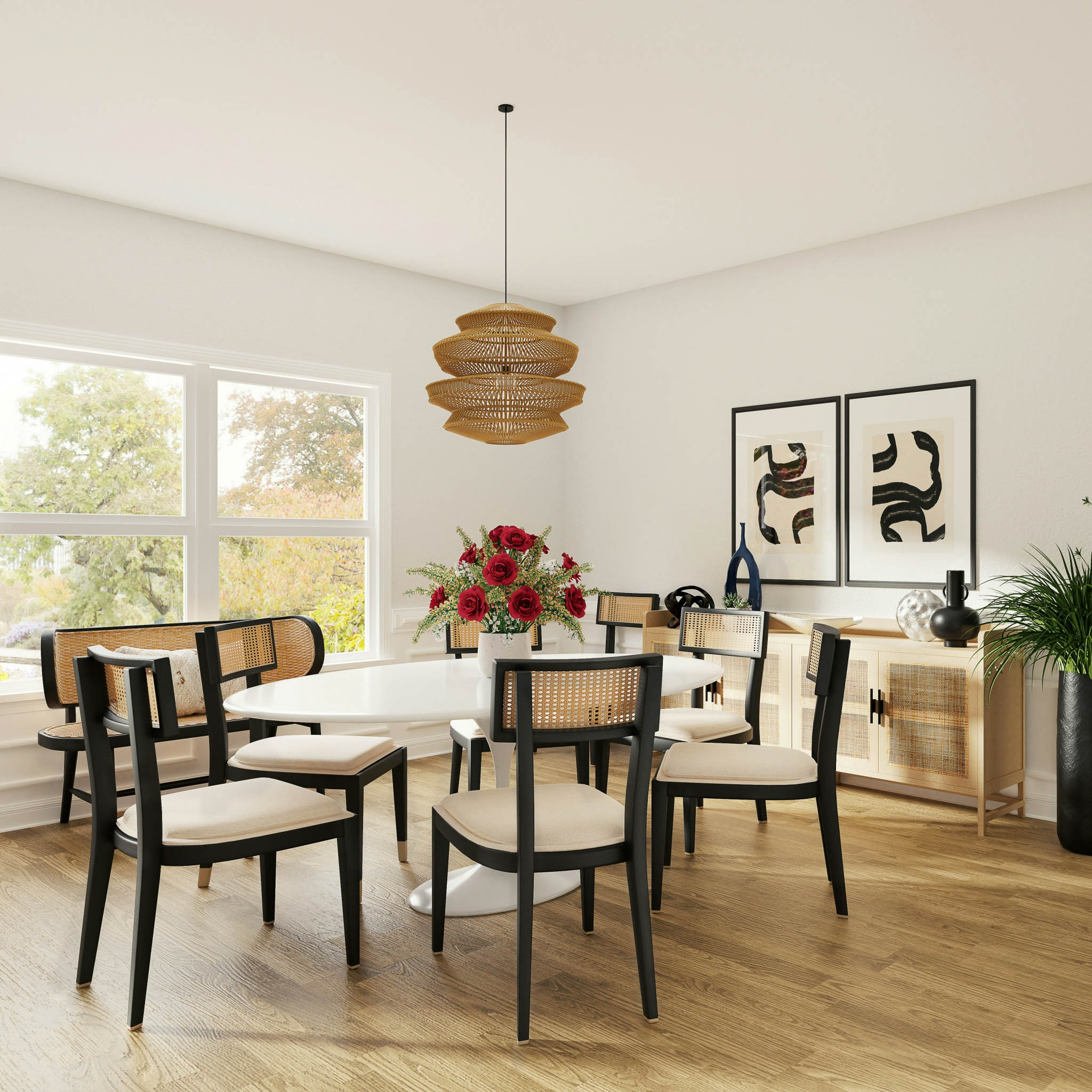 A brightly lit dining area situated by the window and anchored by a woven pendant lamp hanging from the ceiling.