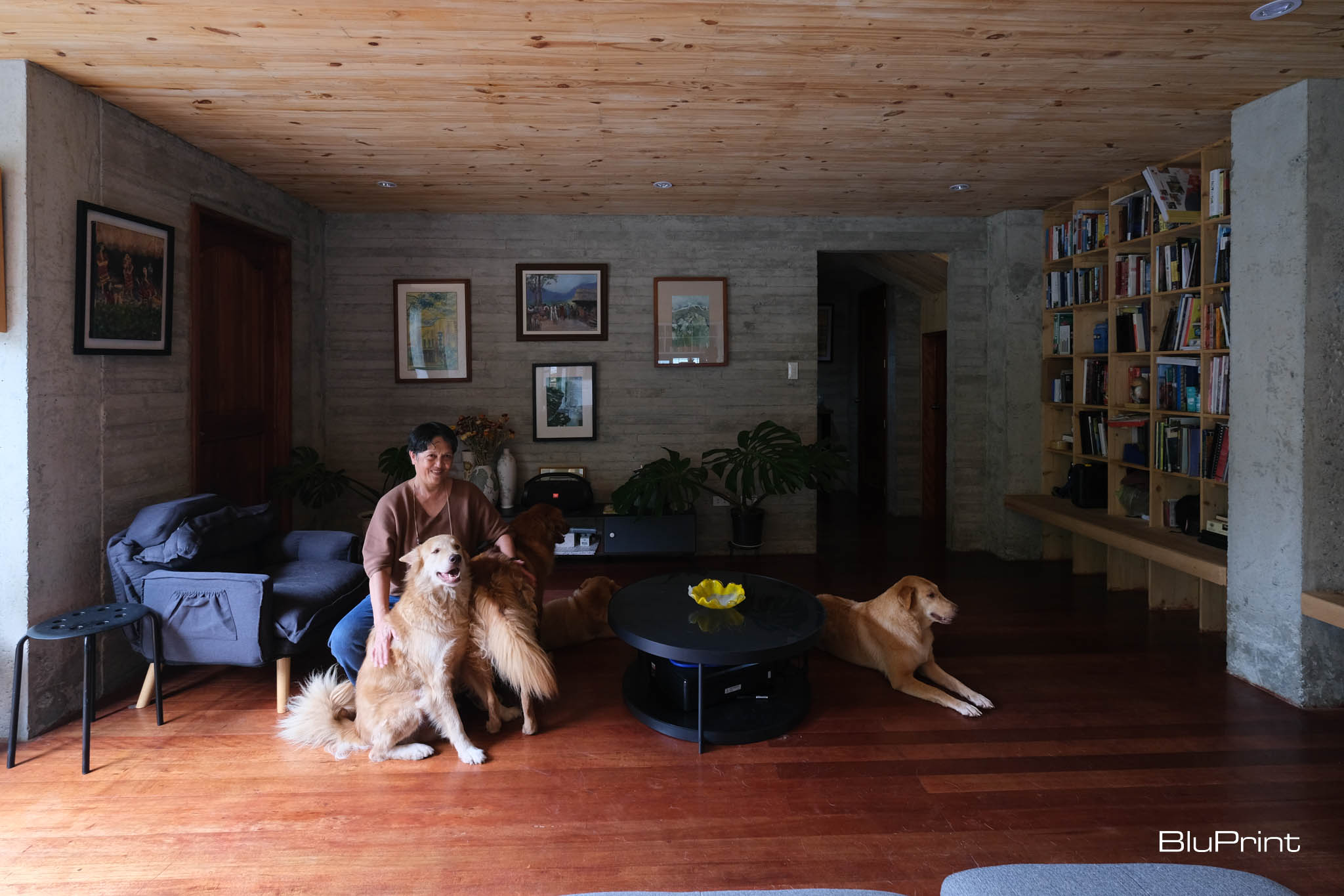 Owner of House C with their dogs