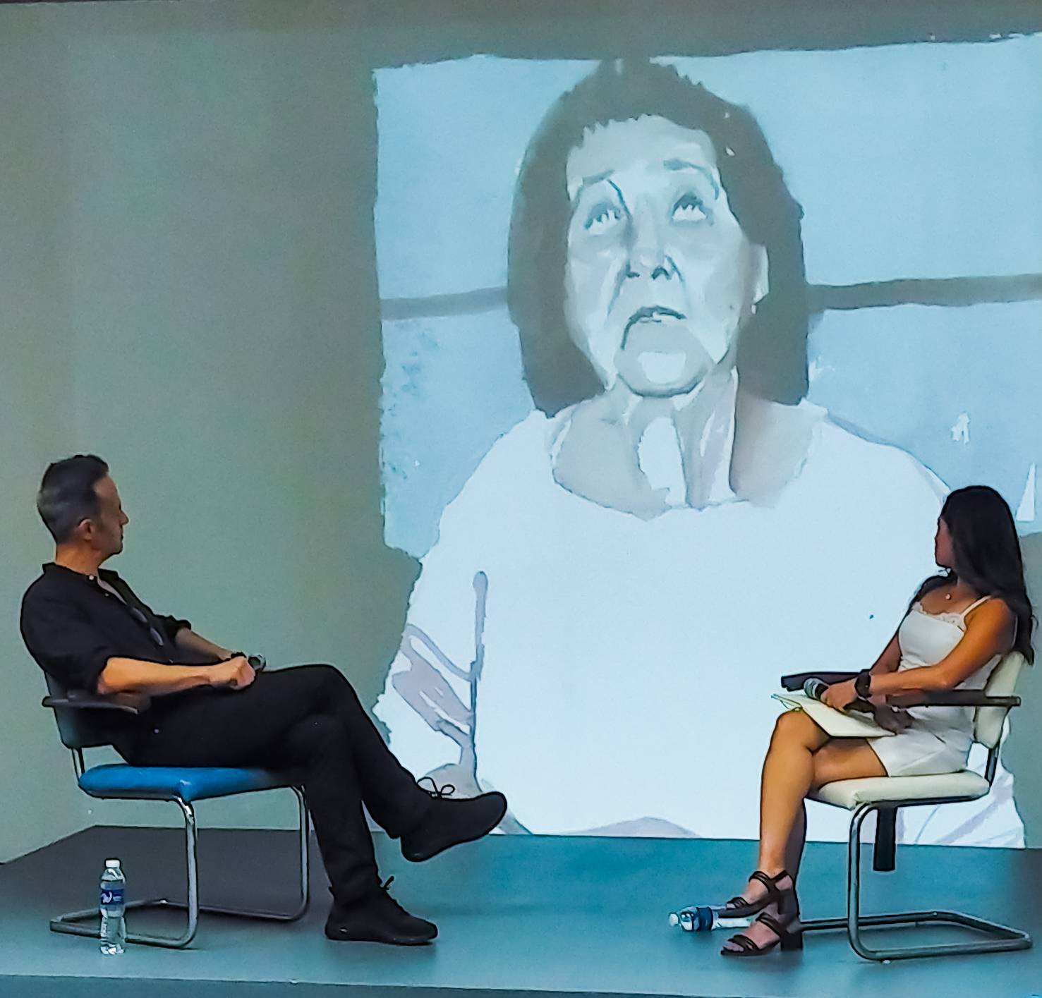 Enrique Marty and Kristine Guzmán staring at a work featured in "Project Belonging." Photo by Patricia Yap.