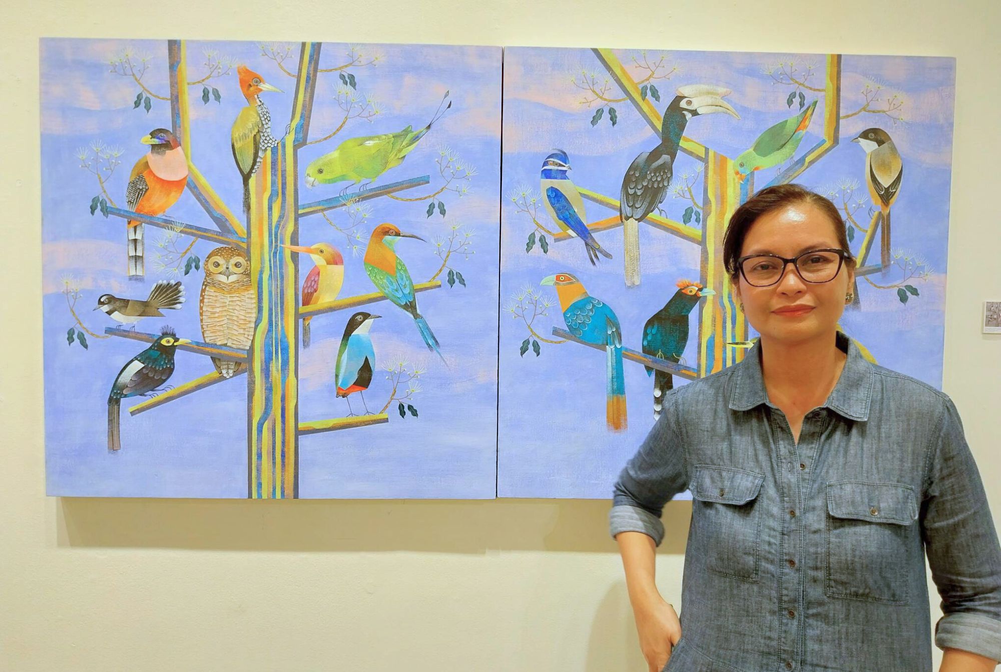 Kat Casapao in fron of one of her paintings for 