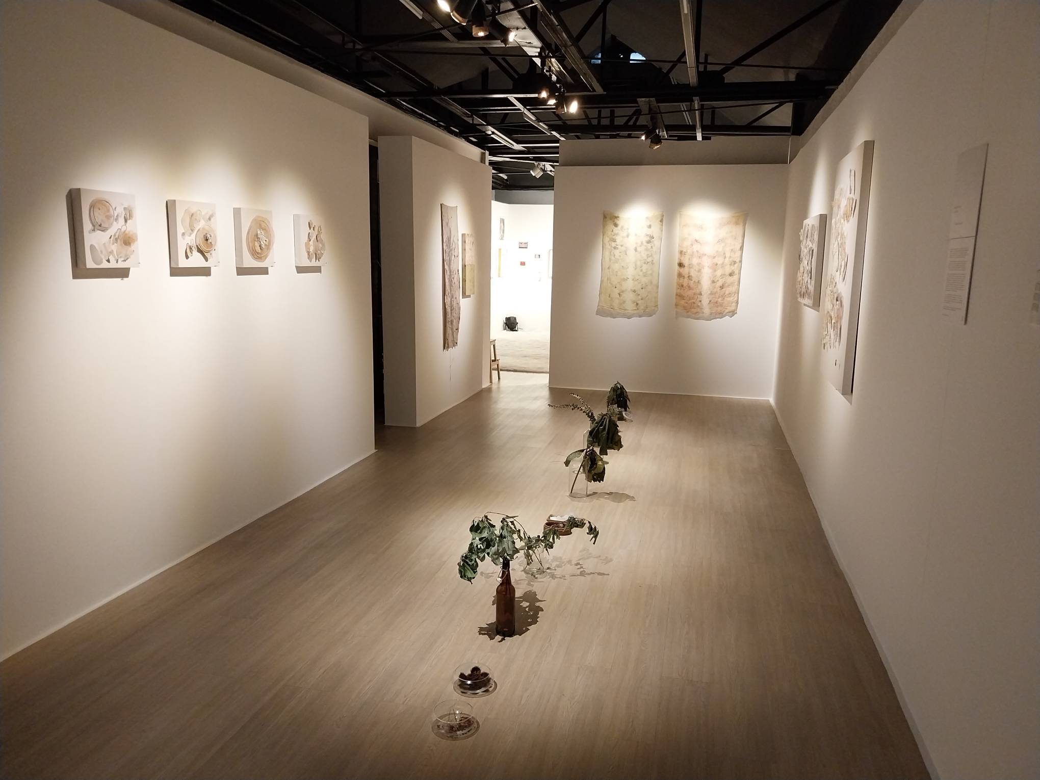 The exhibition floor for Katherine Nuñez's "an open hand, a cosmos" at Gravity Art Space. Photo by Elle Yap.
