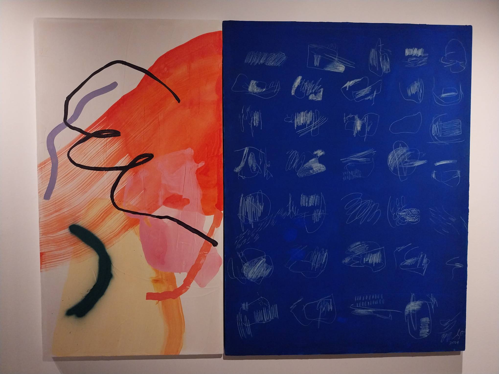 A work by Gabby Prado depicting an abstract painting alongside a blue-white painting.