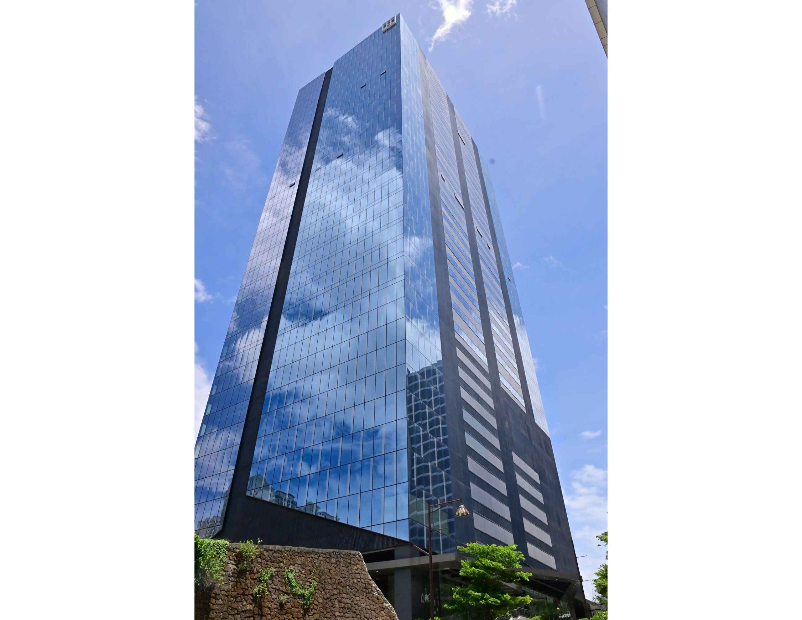 Exterior glass facade of The Glaston Tower by Ortigas Land.